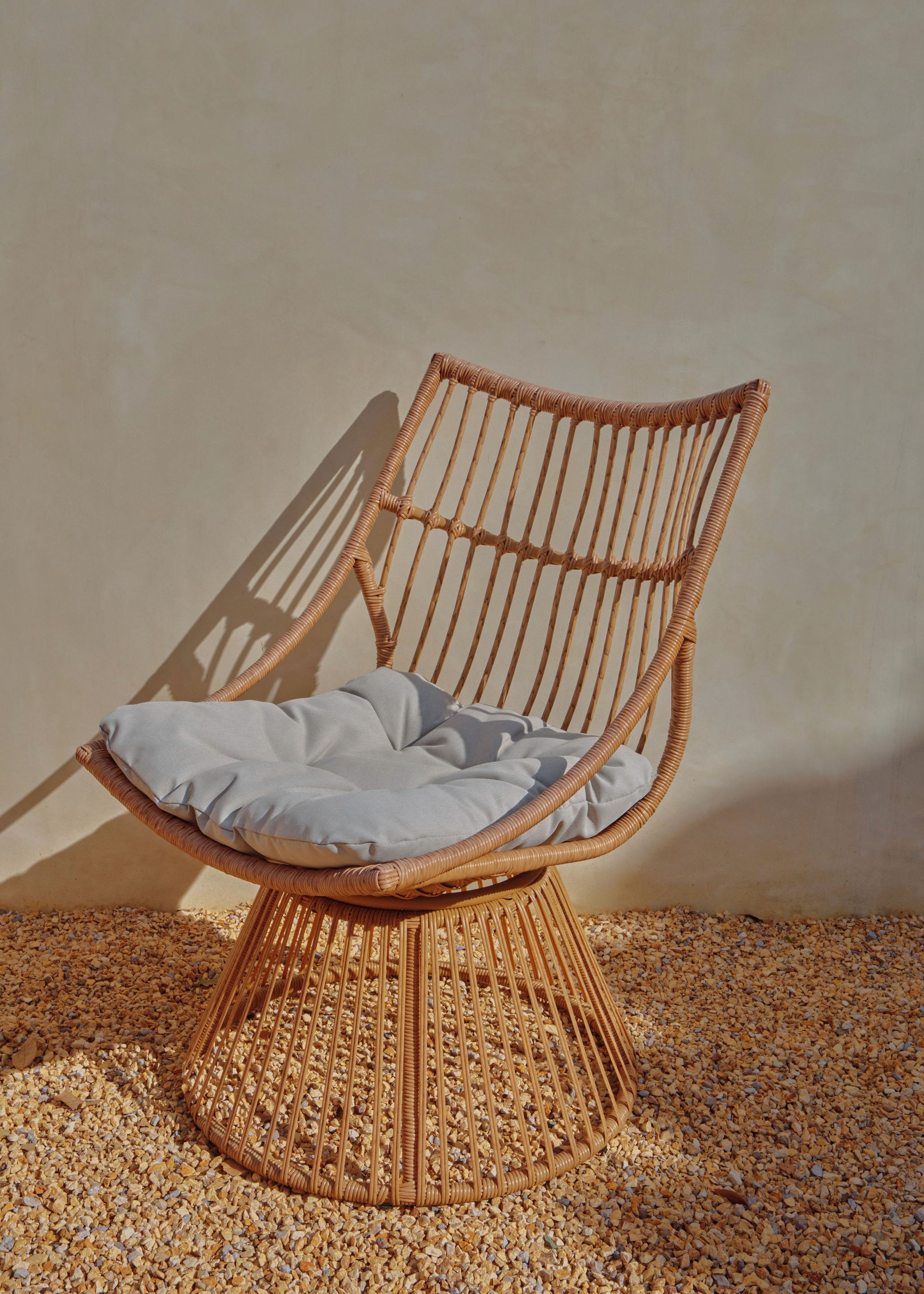 Woman walking on a curved pavement with shadow.