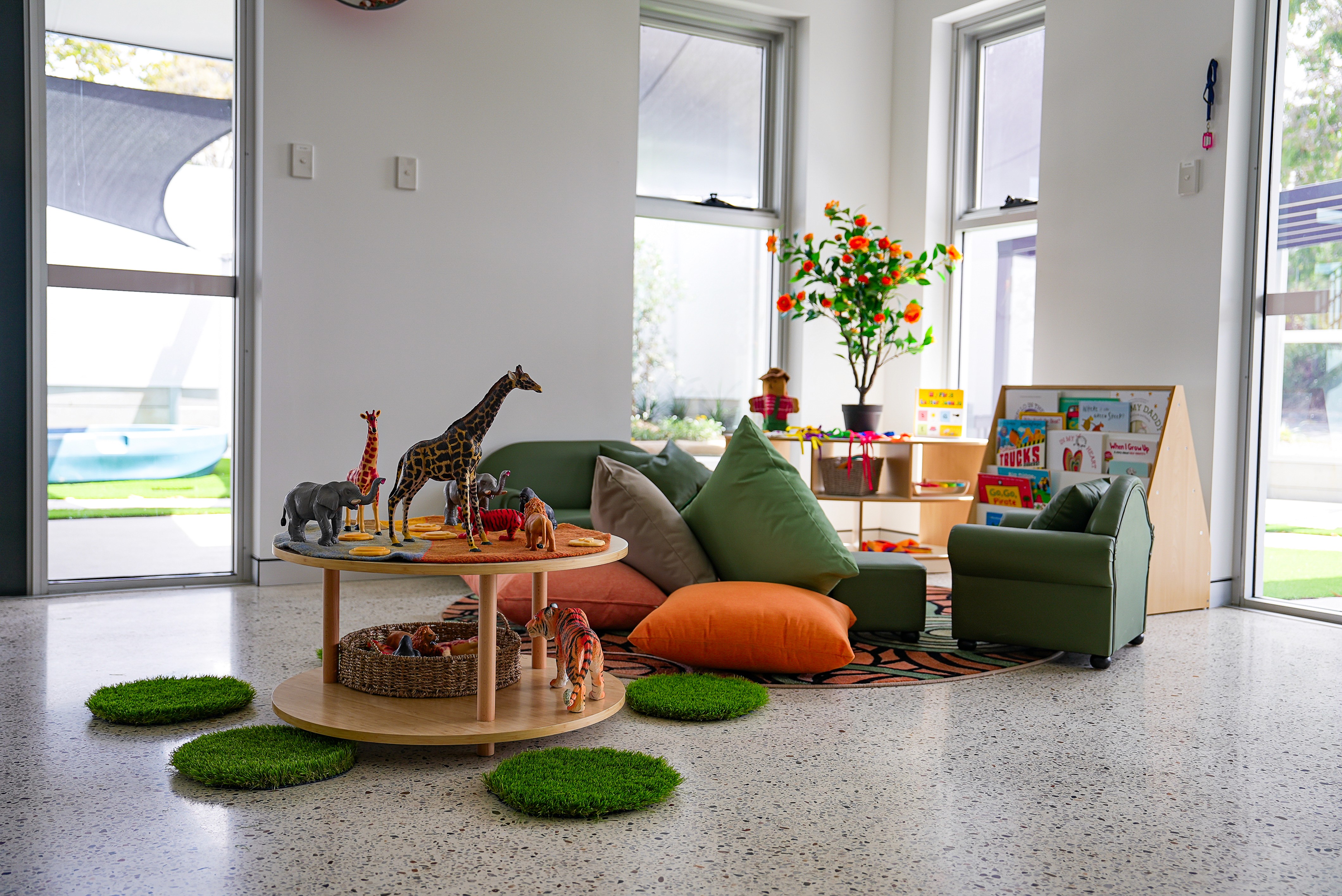 Bright, modern classroom with learning stations and child sized tables at Kaleidoscope Kids childcare centre in Brisbane.