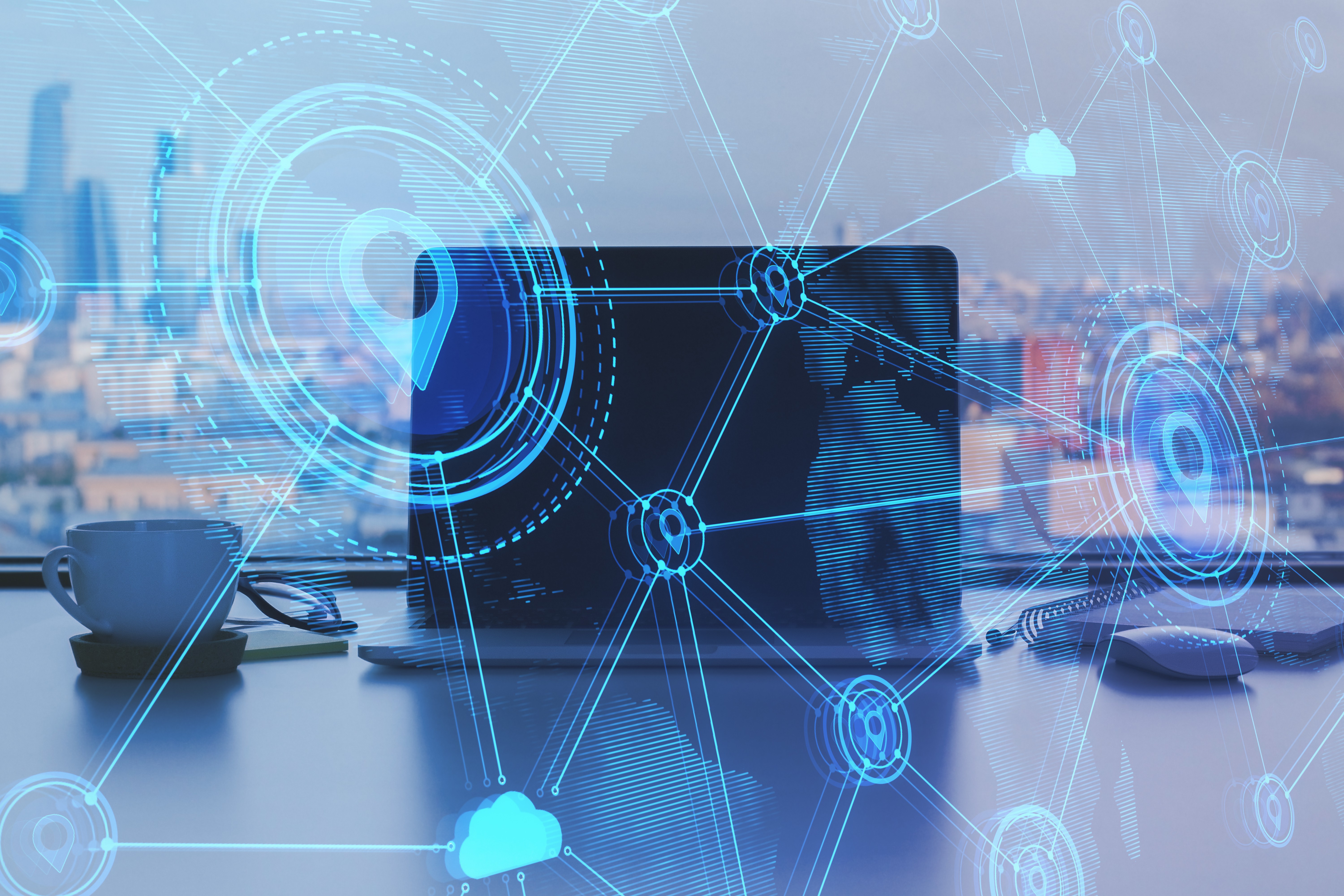 Laptop on a desk with technology grid overlay