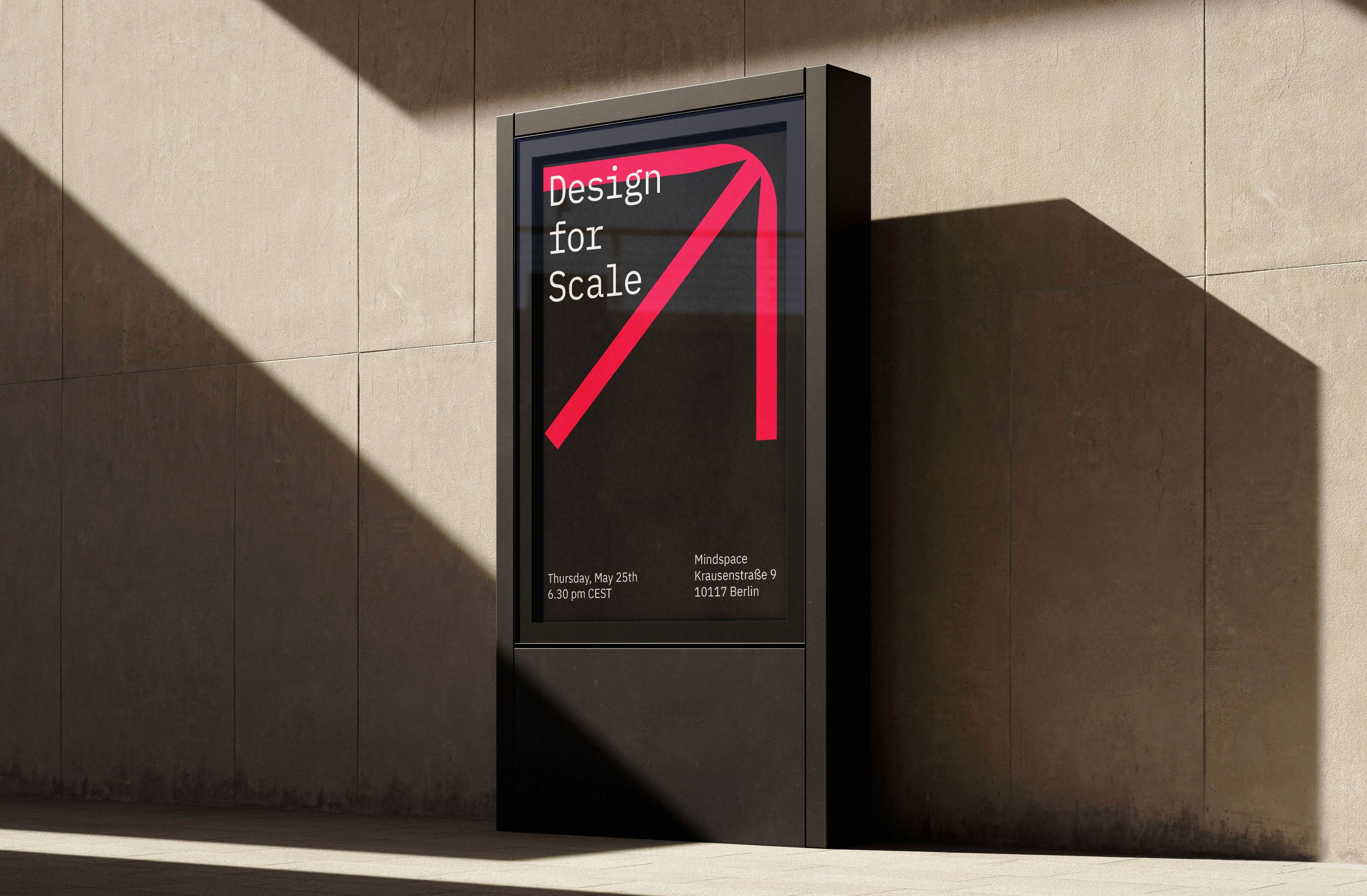 Digital signage displaying "Design for Scale" event details at Mindspace, Berlin.