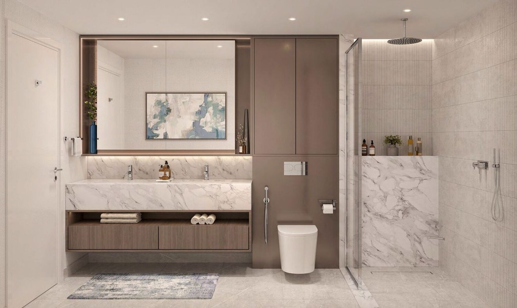 modern bathroom in Windsor House II featuring elegant marble countertops and a spacious shower area.