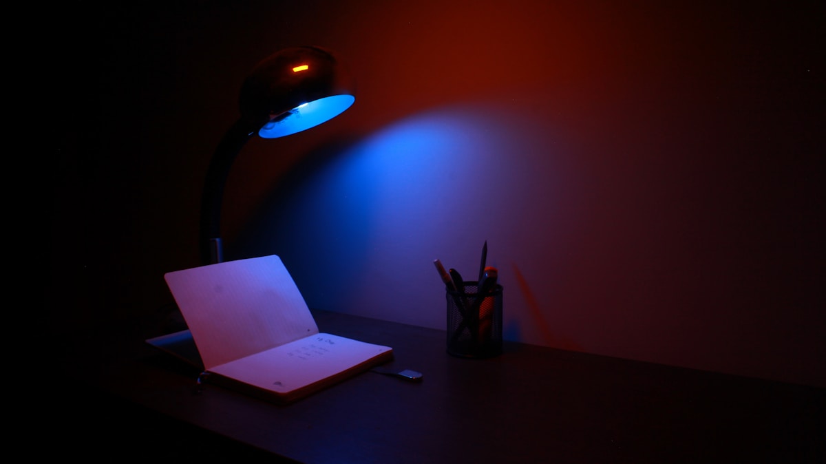 Desk lamp over notes