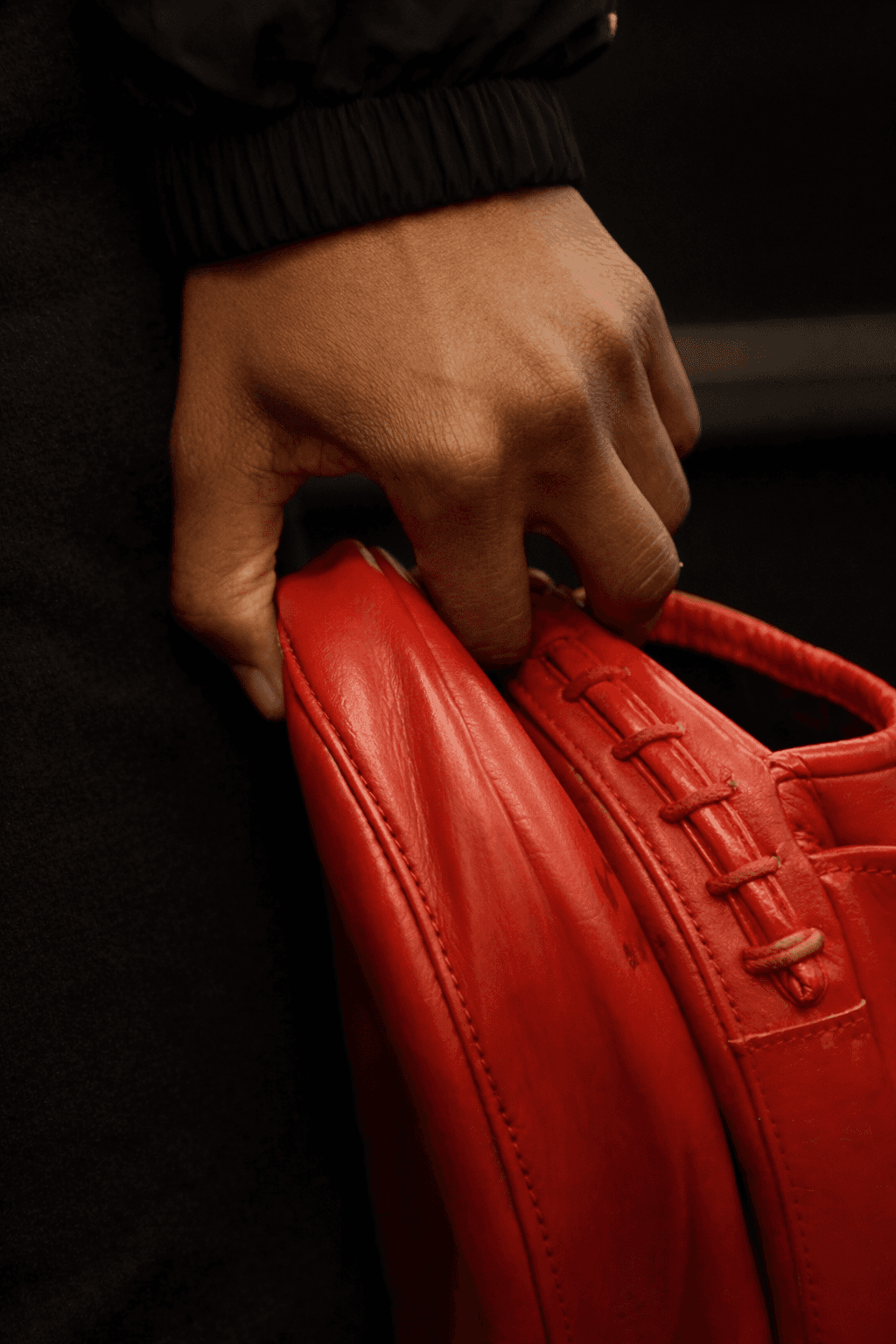 Trainer holding red boxing mitts