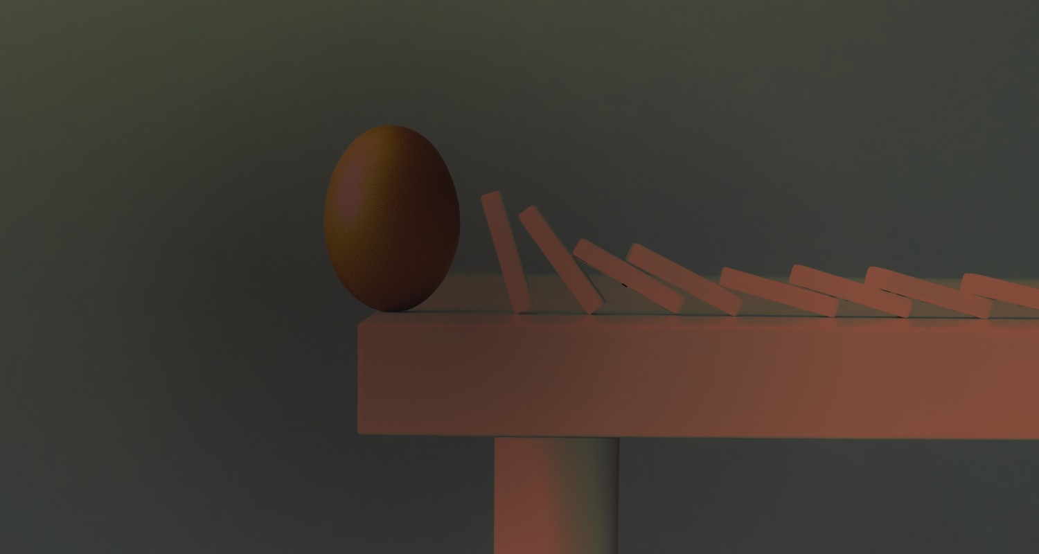 Photo of dominos falling towards an egg on the end of a table, showing what happens when decisions have consequences