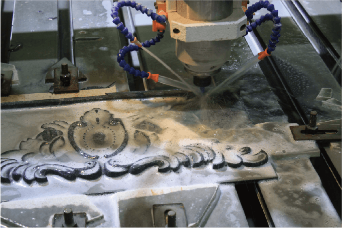 Close-up view of the Engraving Machine in operation, showcasing its precise cutting ability on intricate stone patterns.