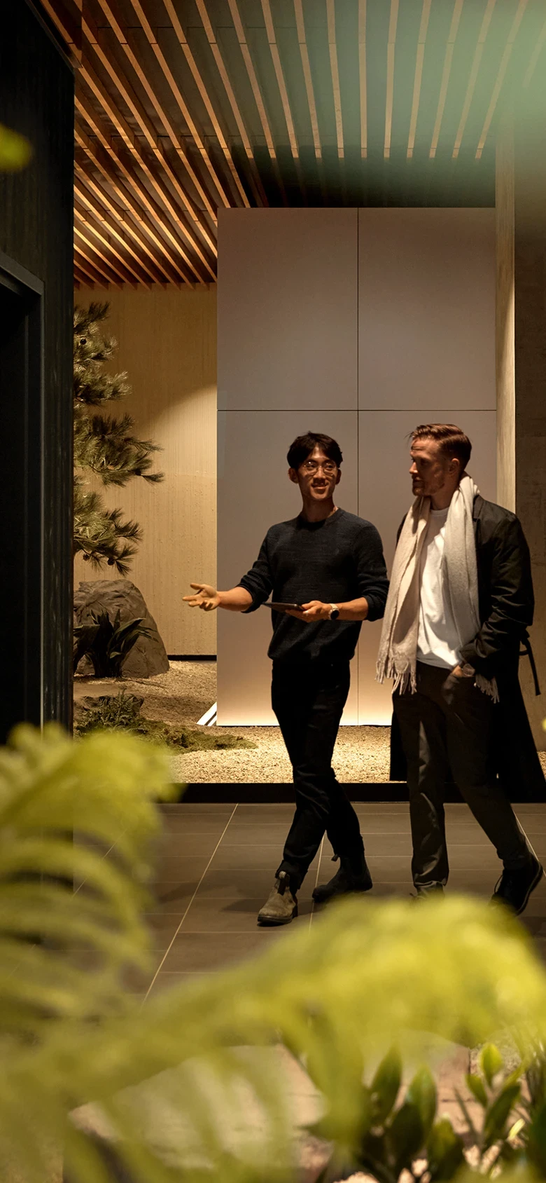 Biograph NYC hallway with natural design elements and a central tree for a serene experience.