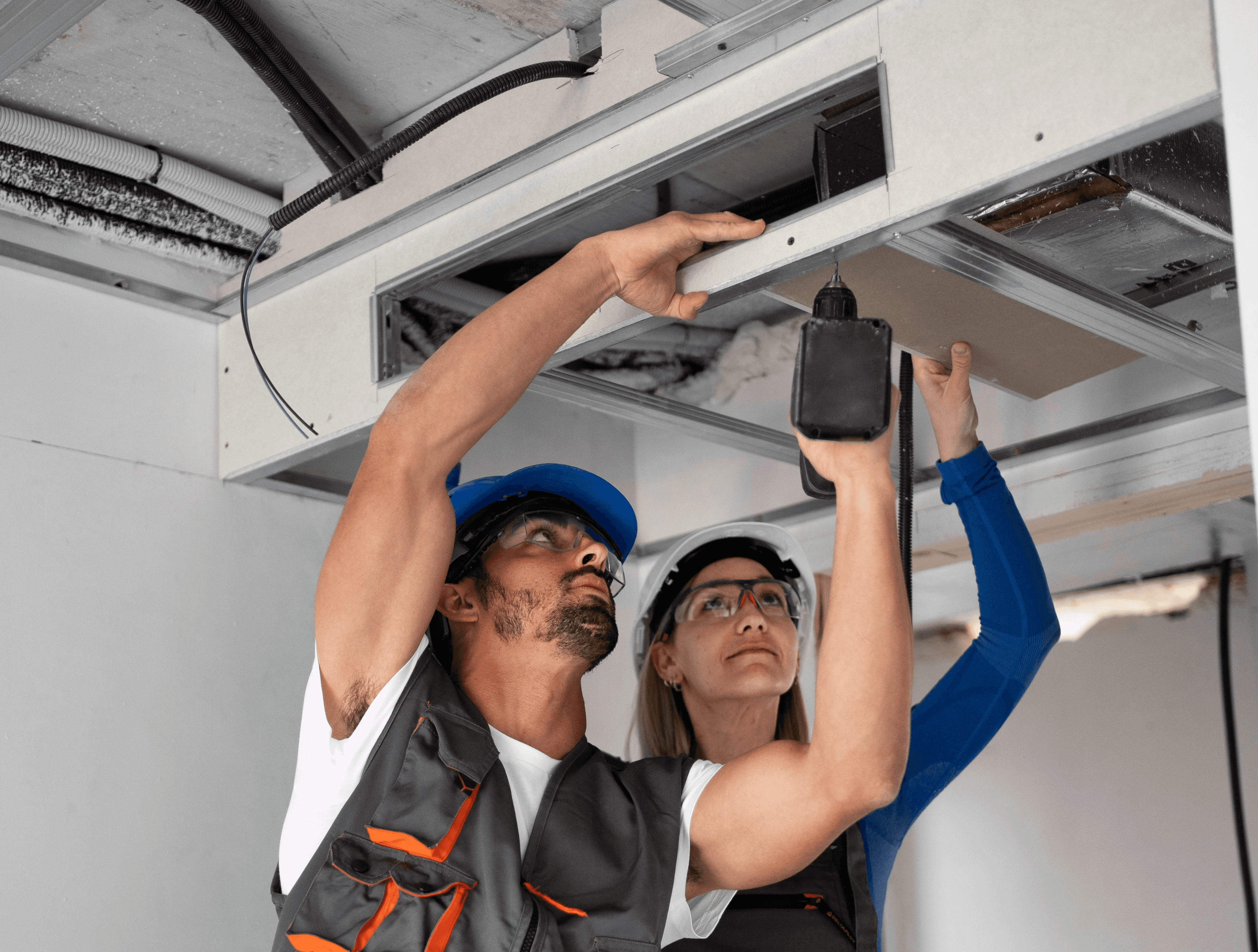 HVAC contractors are doing ductwork in a house of Grapevine