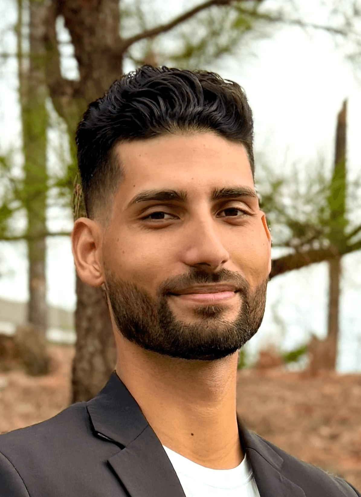 woman in white crew neck shirt smiling