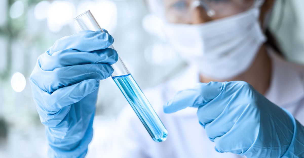 Scientis holding reagent