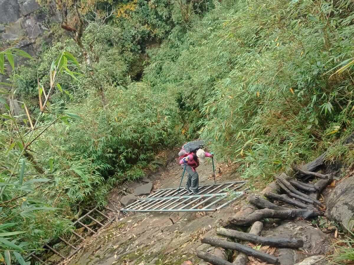 Technical section of the Fansipan trekking route with steep mountain terrain