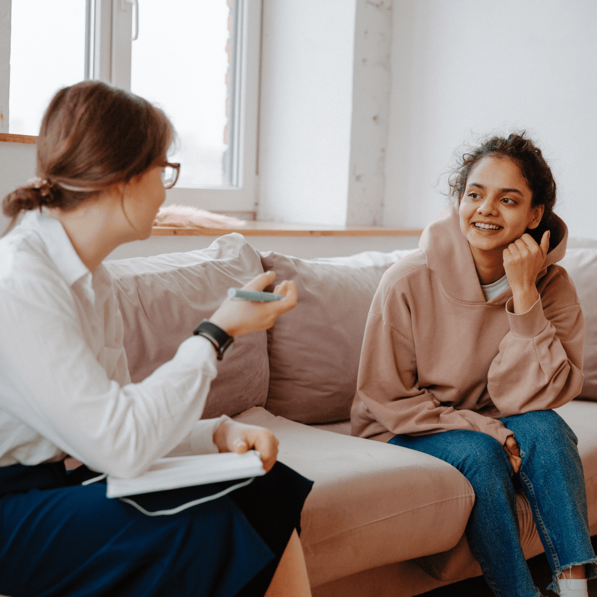 Woman speaking with a therapist during a mental health counselling session.
