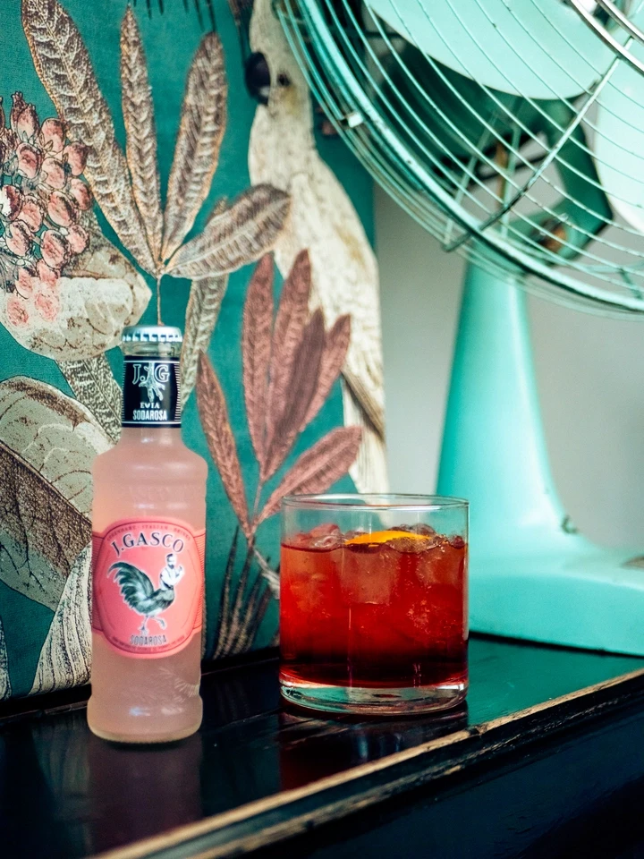 Woman pulling back a barstool