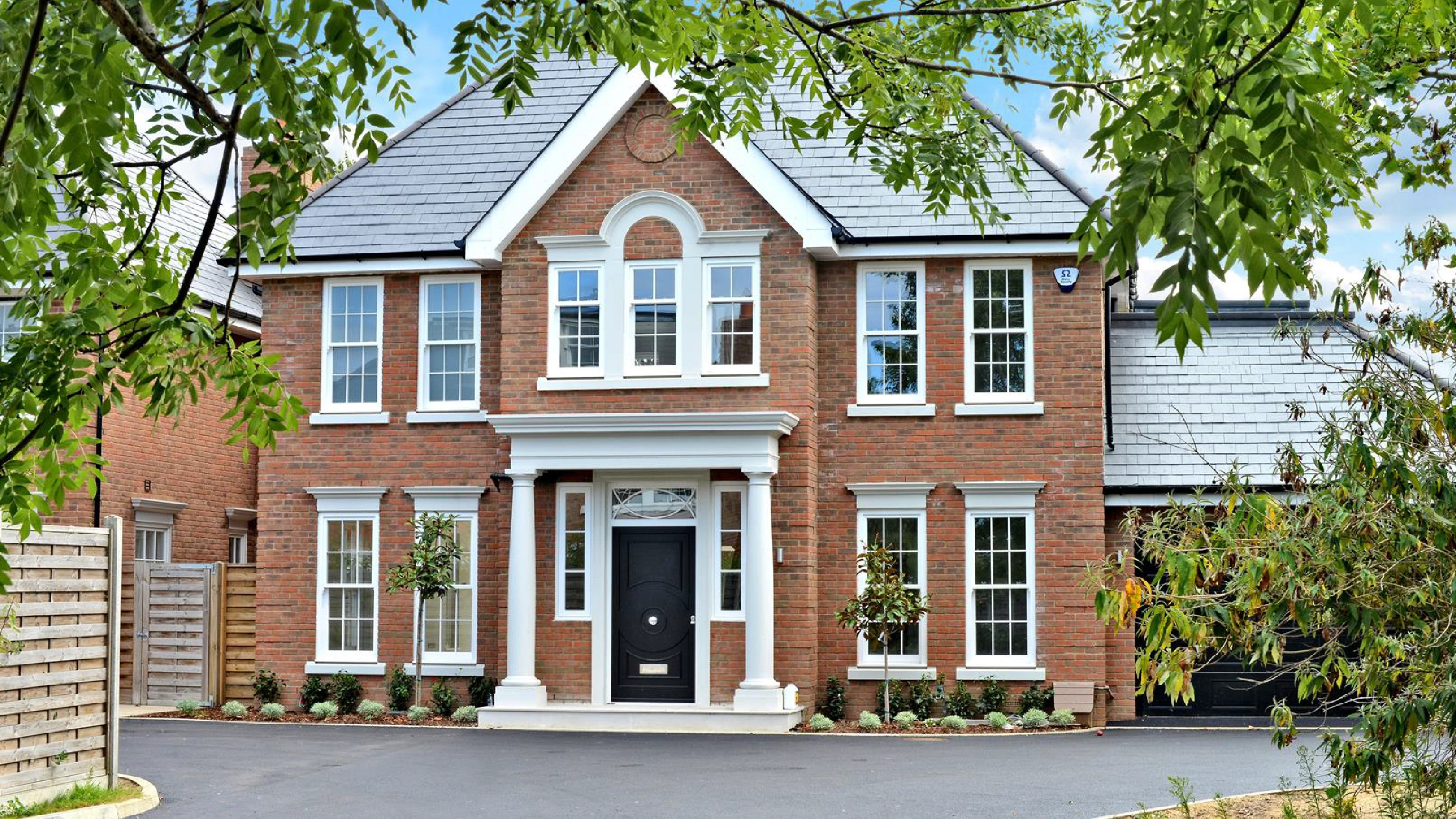 Iris Gardens property with garden foliage and driveway