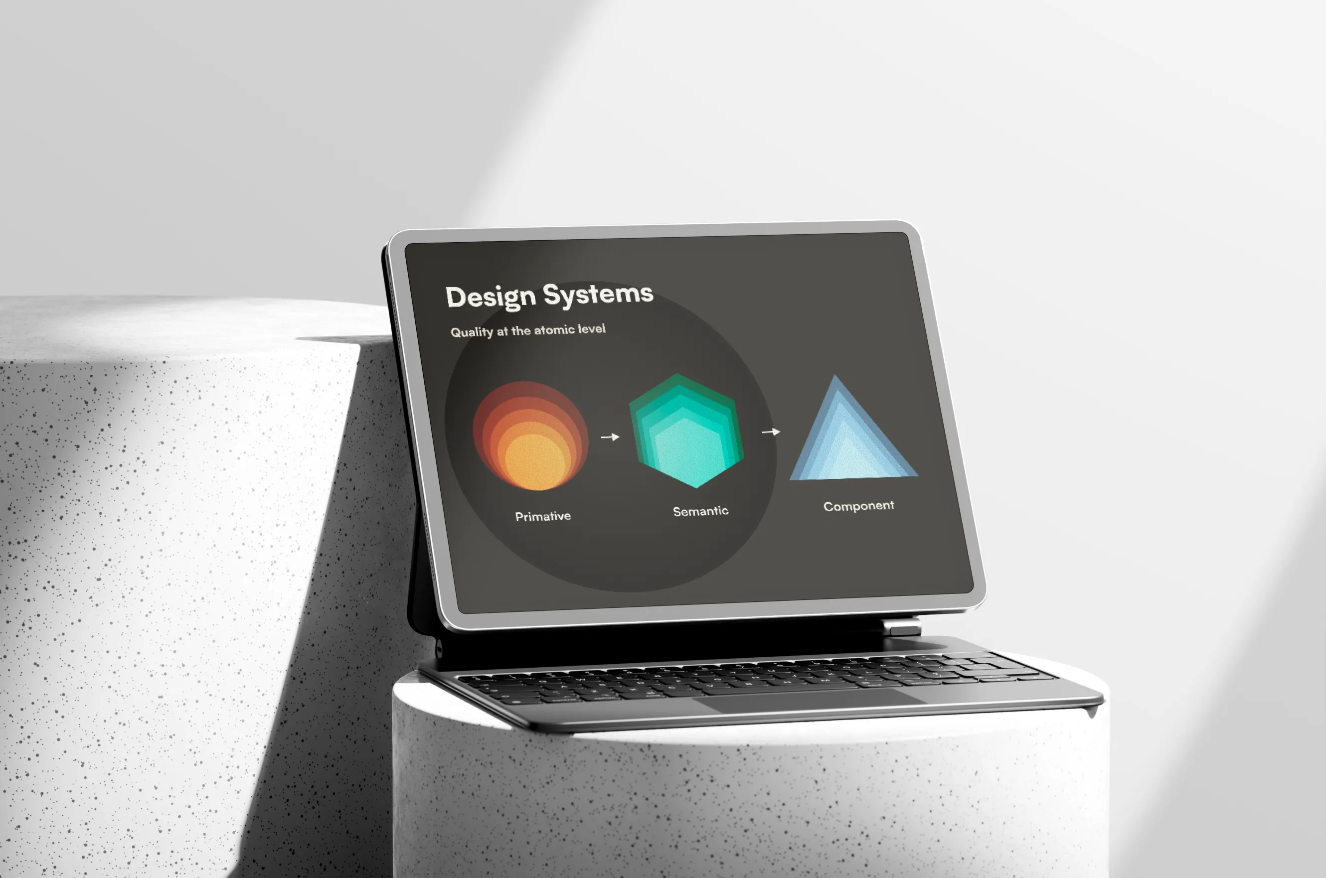 iPad displaying a design systems slide showing the token hierarchy: Primitive (sphere), Semantic (hexagon), and Component (triangle)