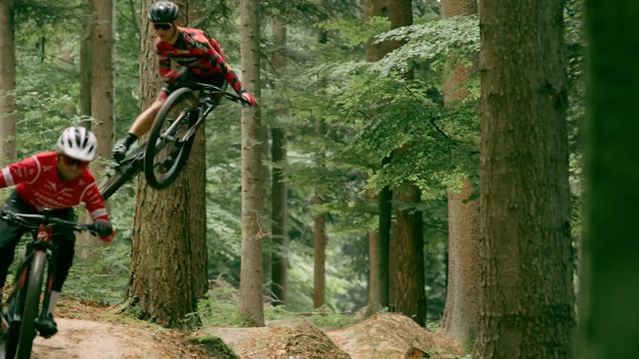 MTBer makes a big jump in the forest
