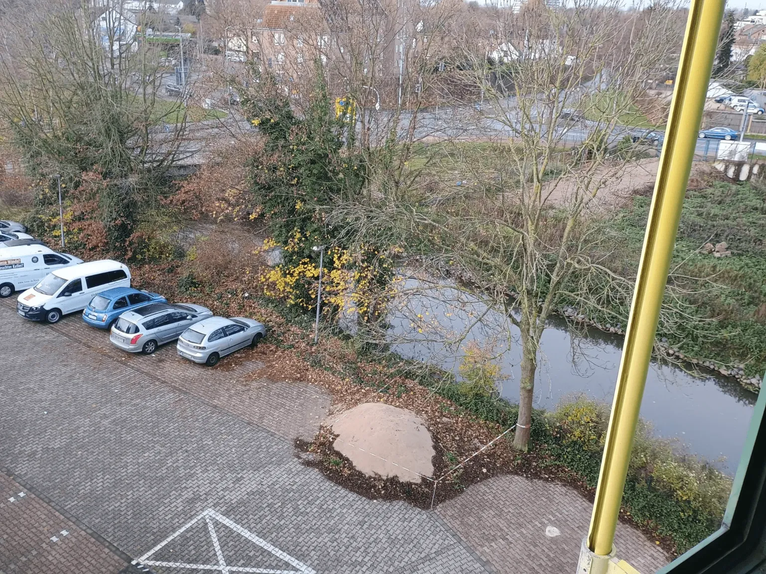 Modern office reception area with wooden paneling and waiting area.