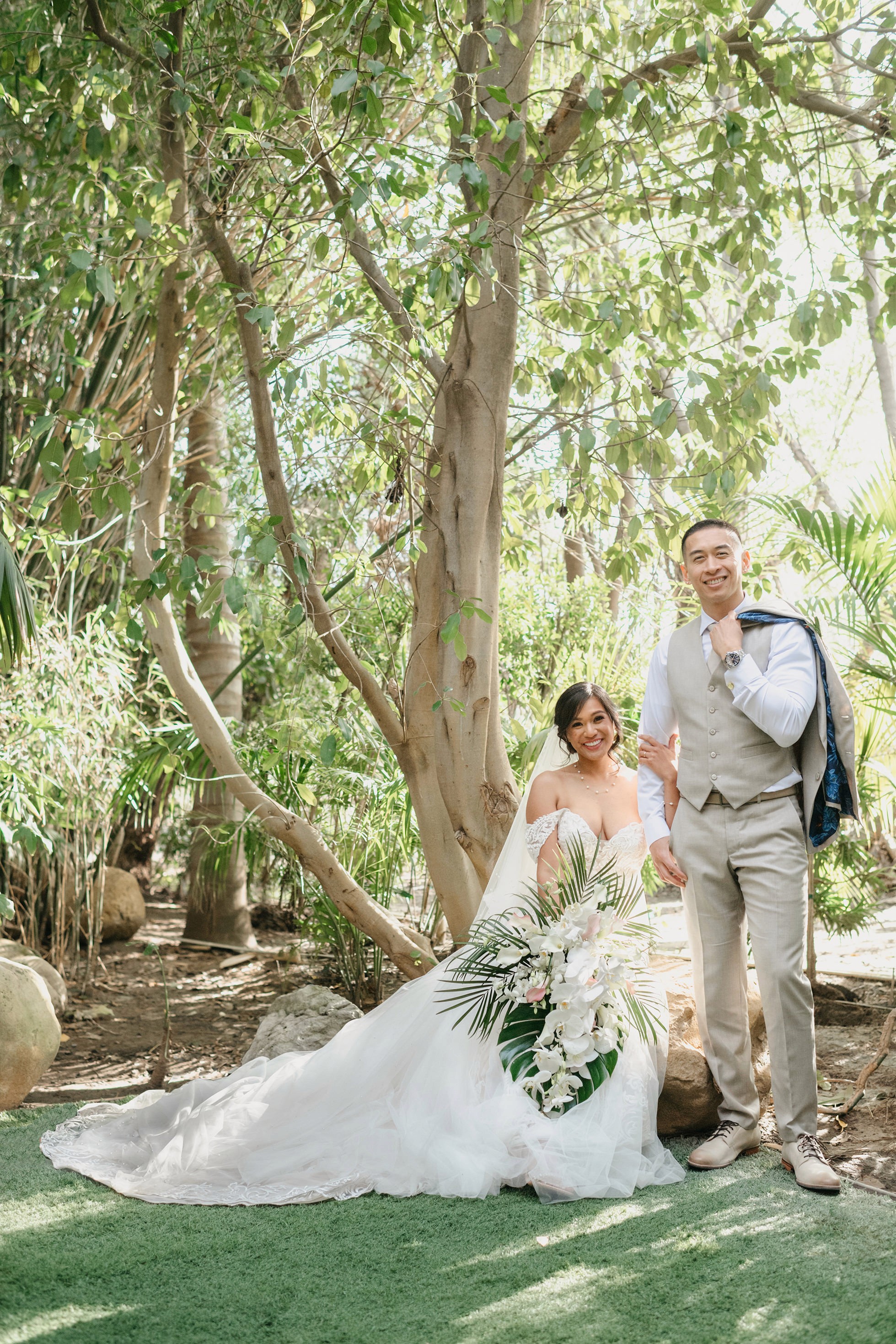 Romantic bride and groom portraits in lush greenery at Hartley Botanica