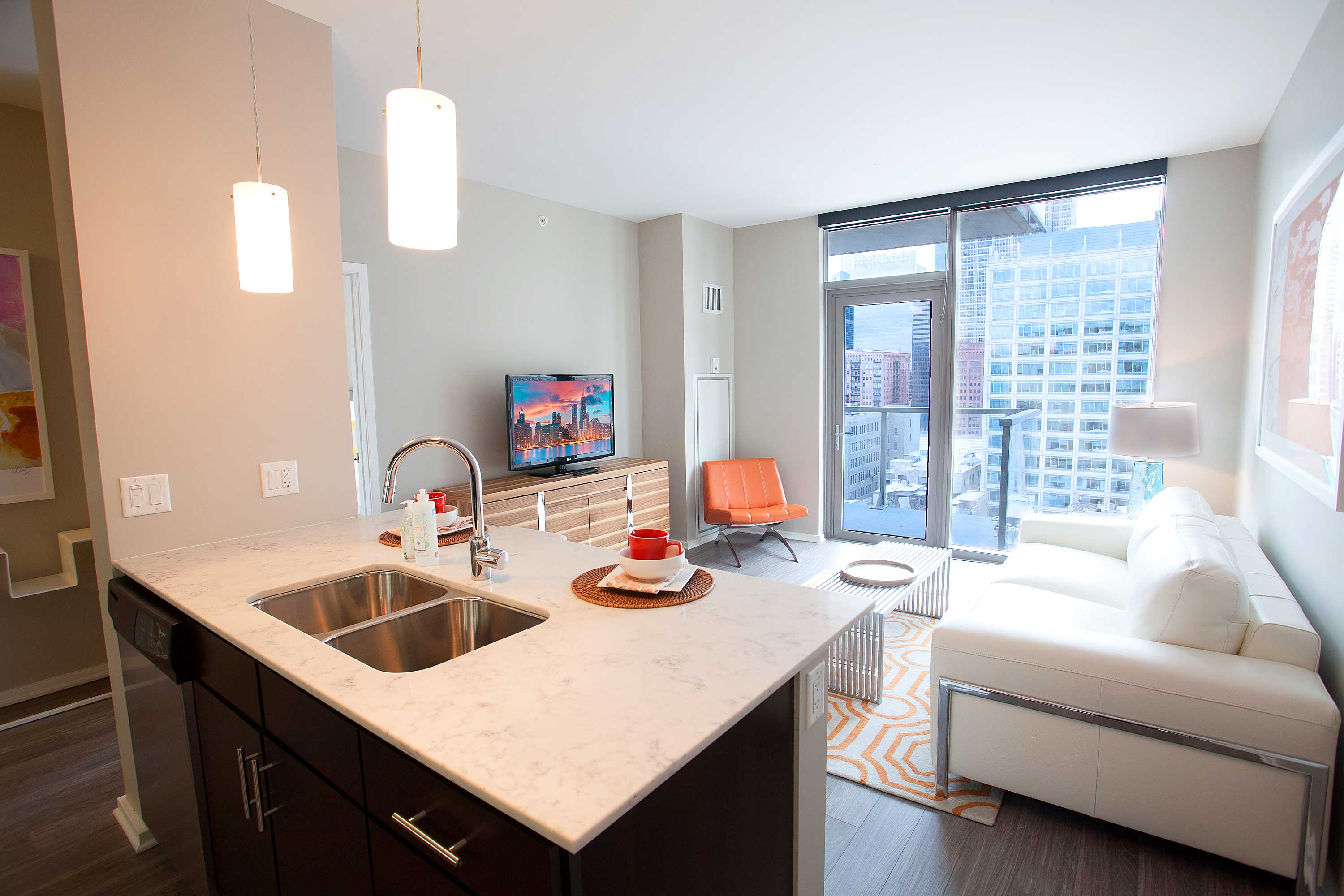 Living room and kitchen at Catalyst luxury West Loop Chicago apartments