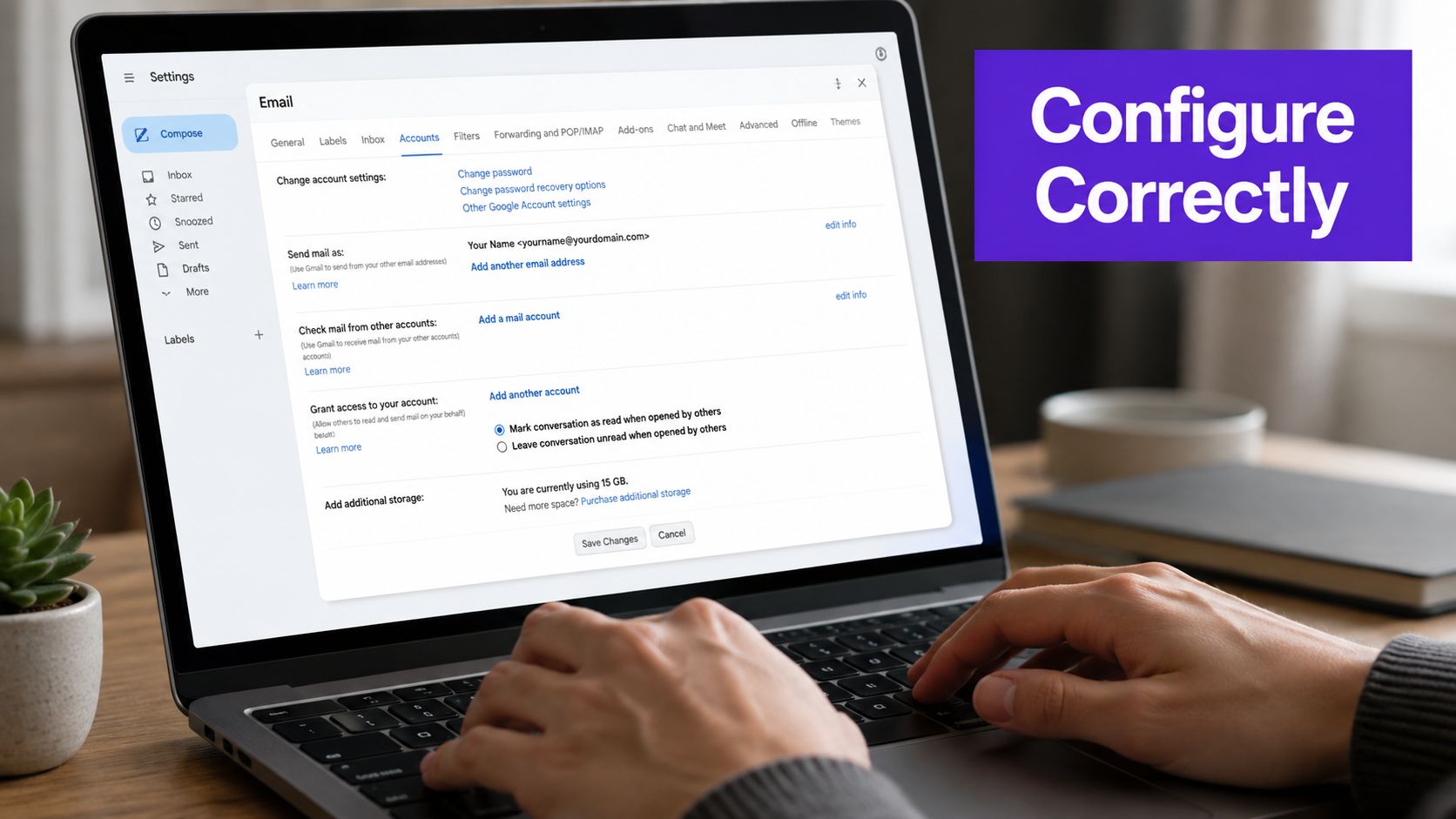 A person using a laptop to configure email account settings in a web browser interface.