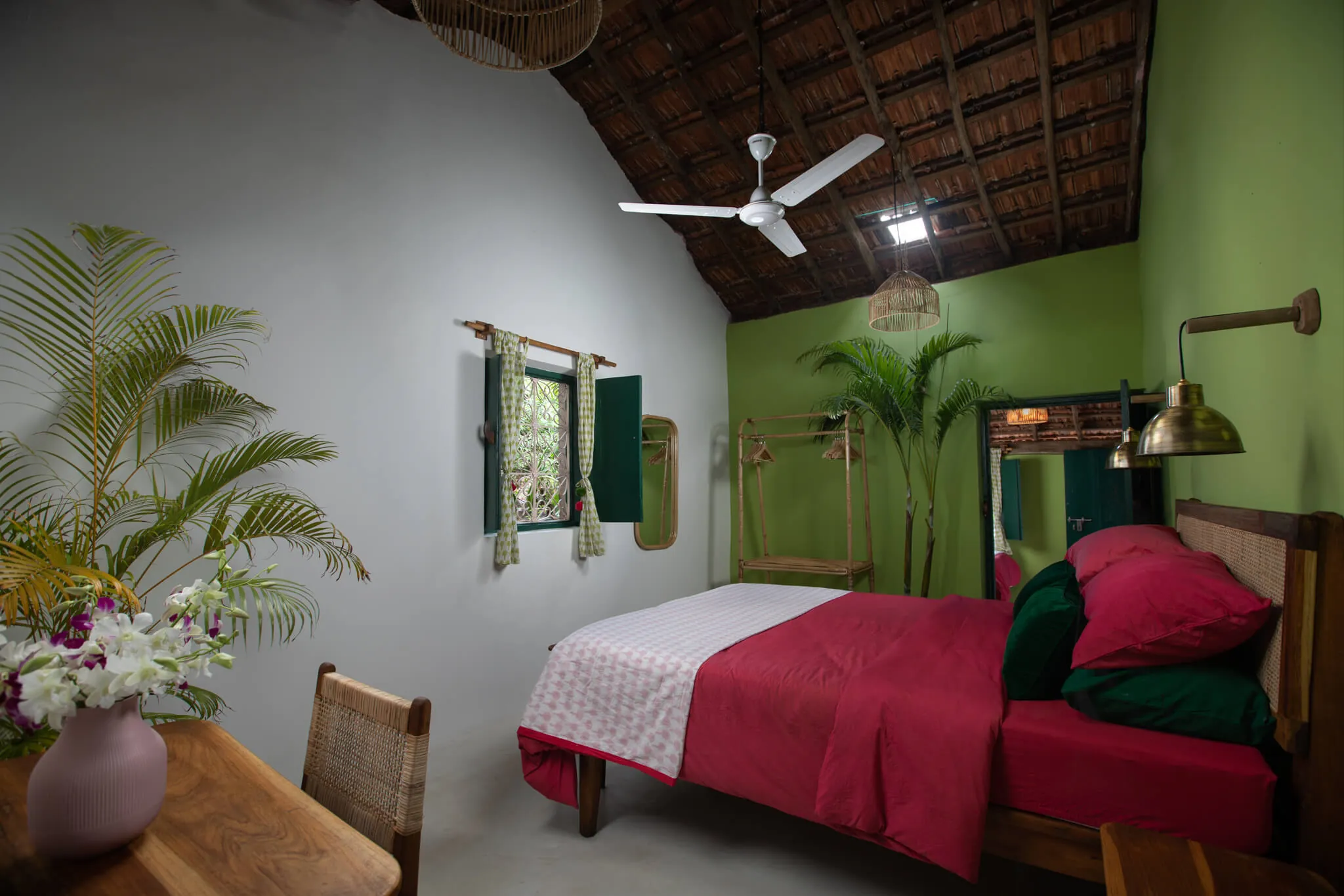Split-level bedroom with red block-print bedding at Casa Jaali