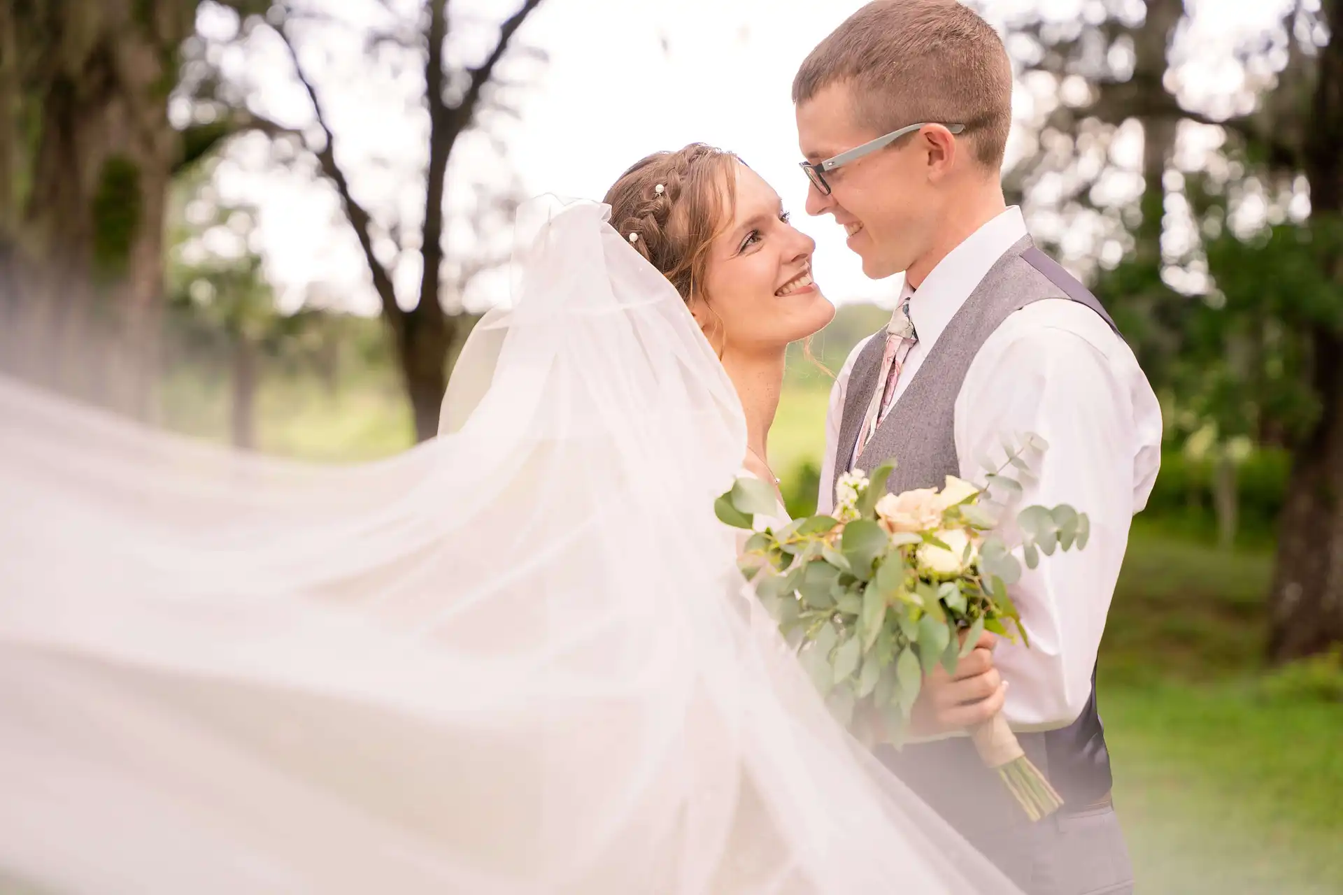 A man and a woman embracing each other, staring into each other's eyes
