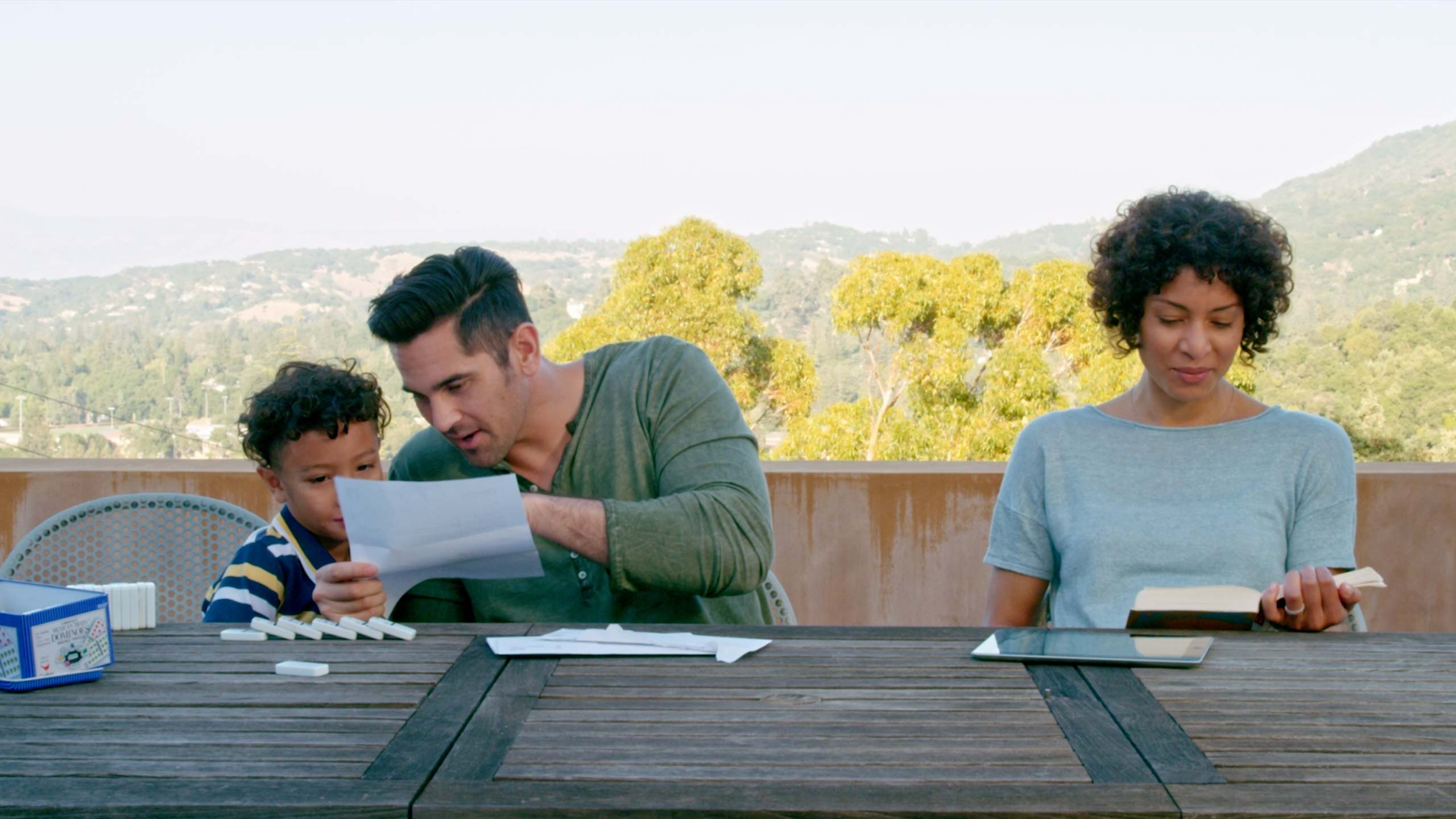 Still from the movie showing the family on the patio together