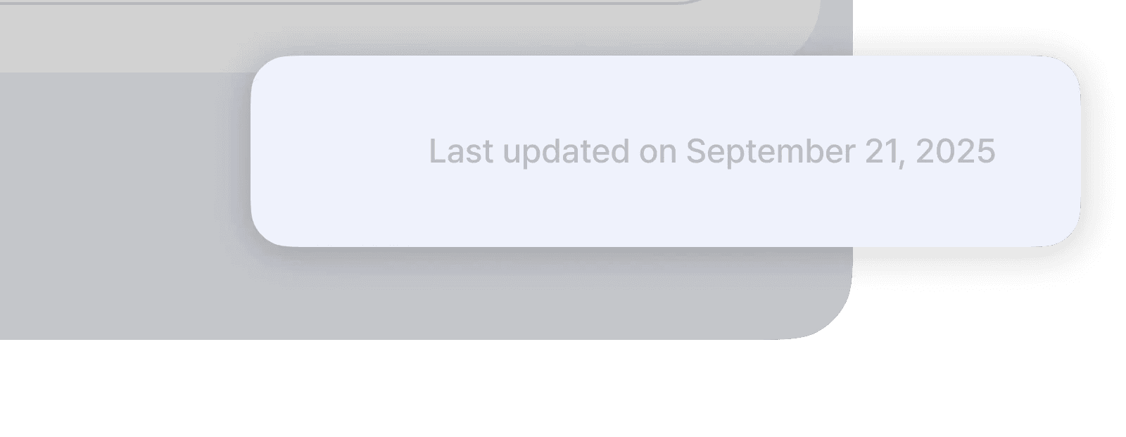 leafless tree on the field near the lake