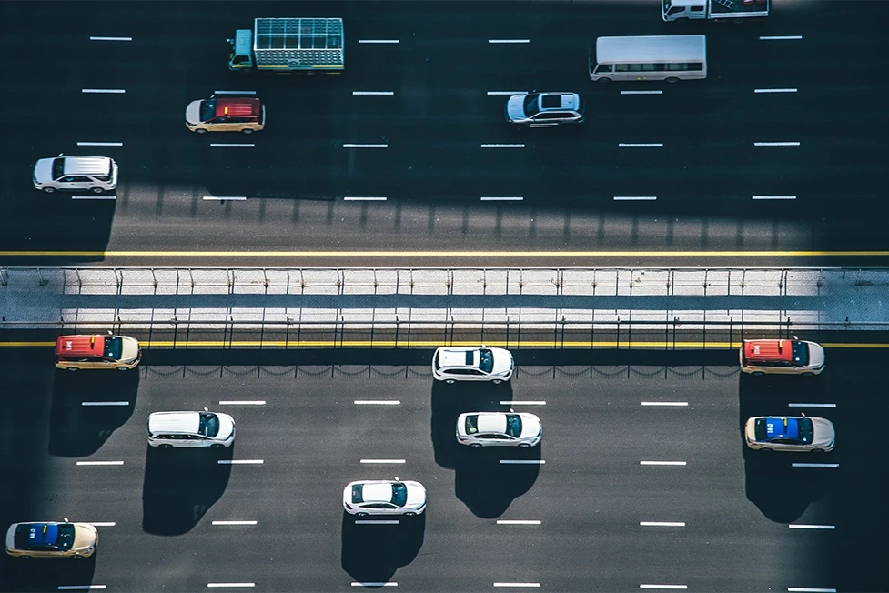 Multi-lane California highway shown from above, symbolizing the severe injuries bus crash victims often face