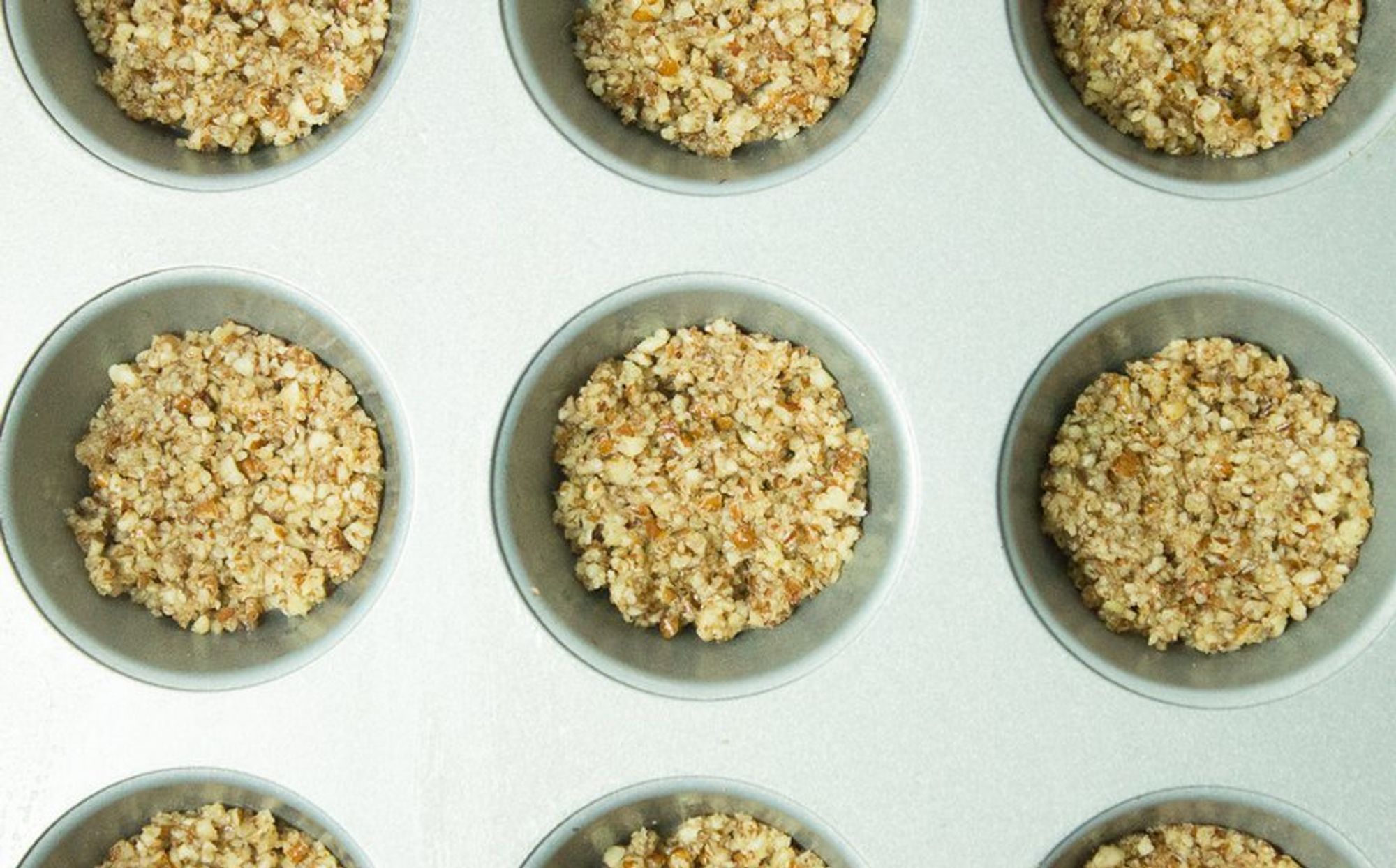 processed nuts on a muffin molder