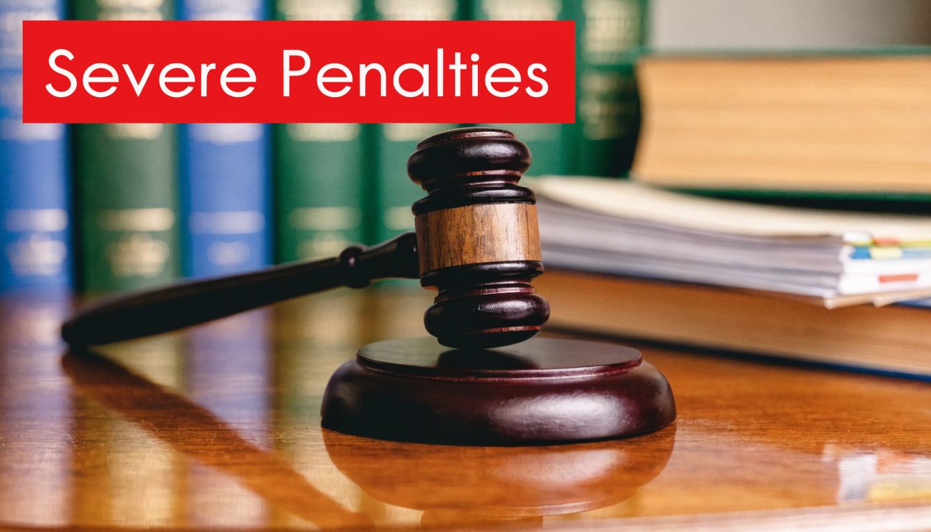 A wooden judges gavel resting on a table in front of legal books in a library.