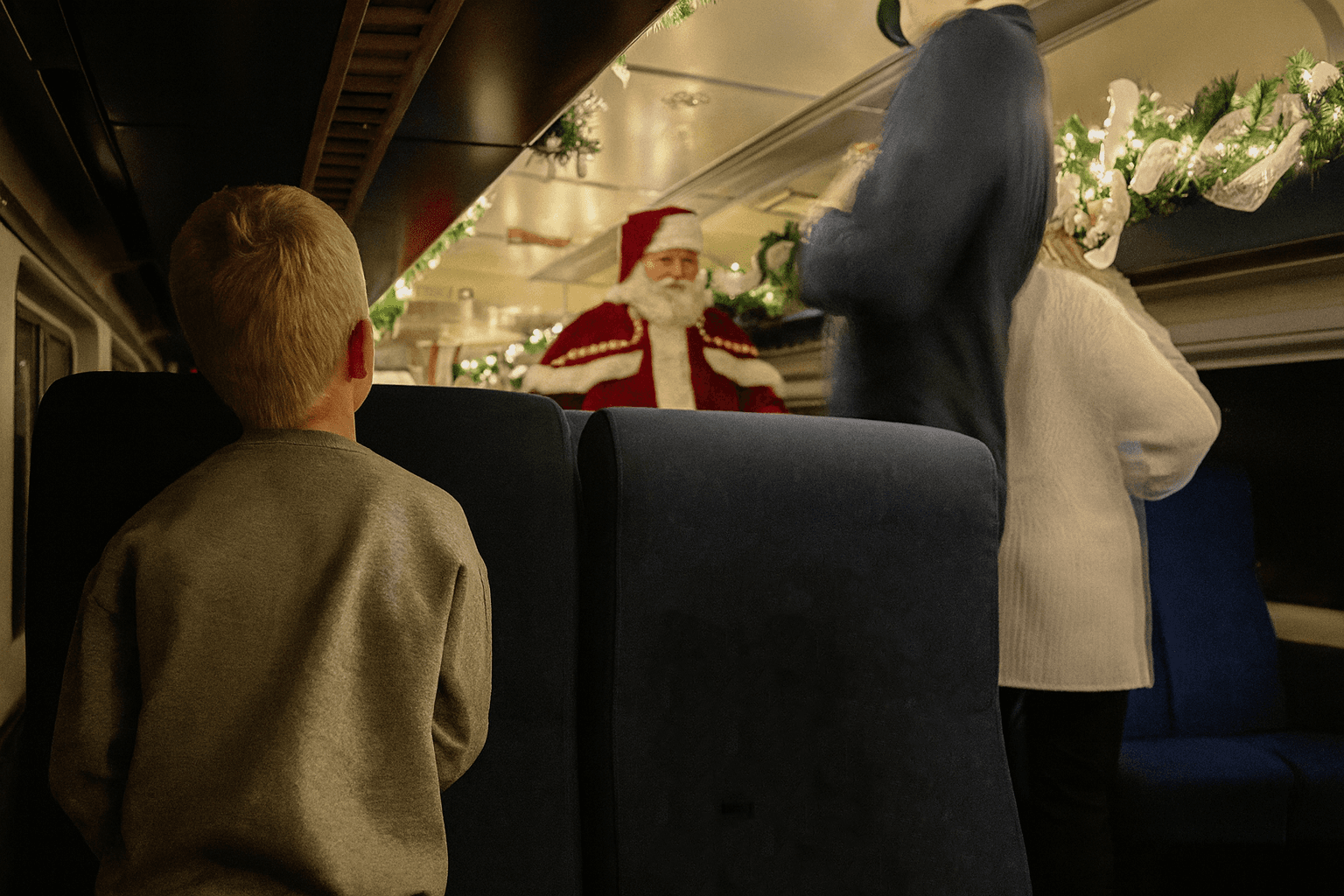 Child watches as Santa approaches
