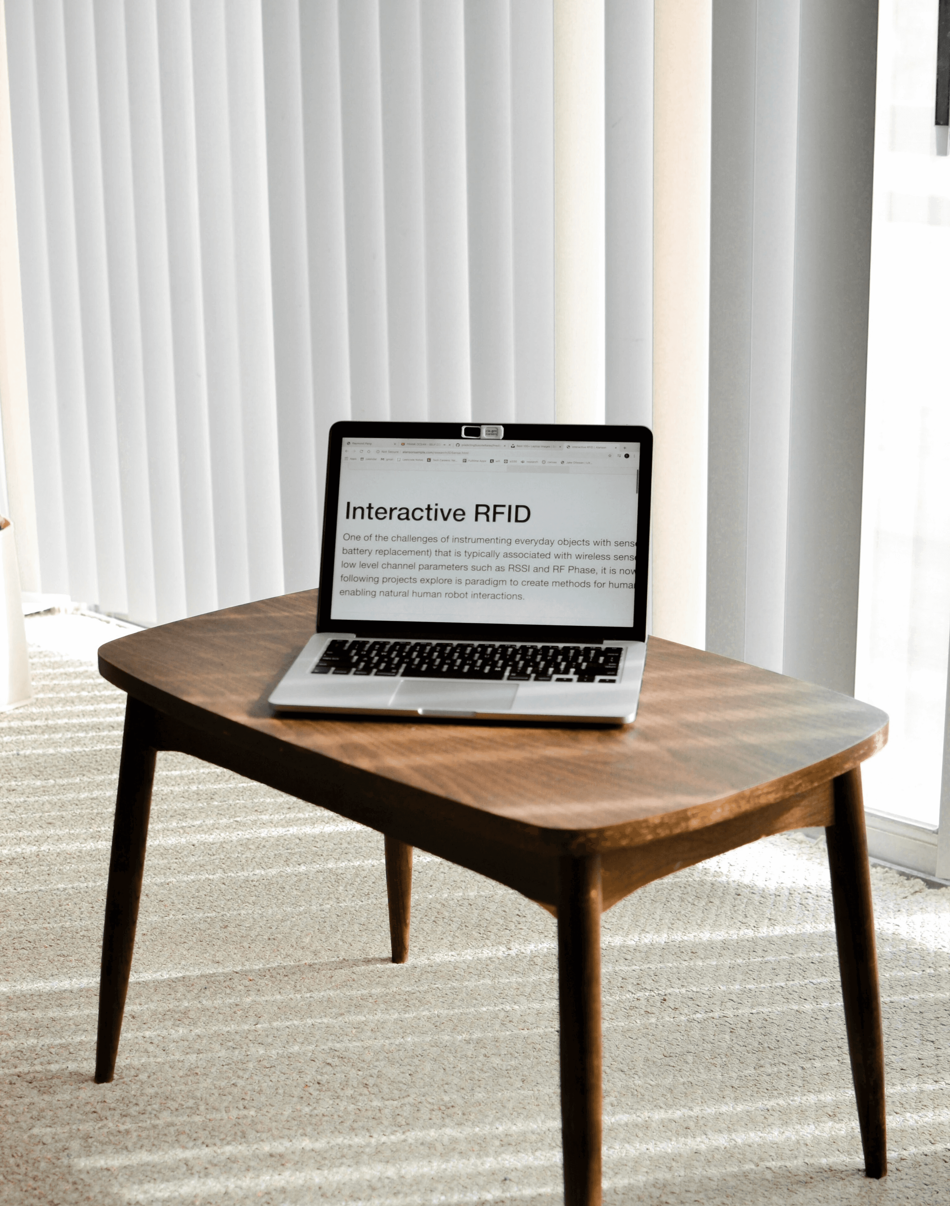 black laptop computer on brown wooden table