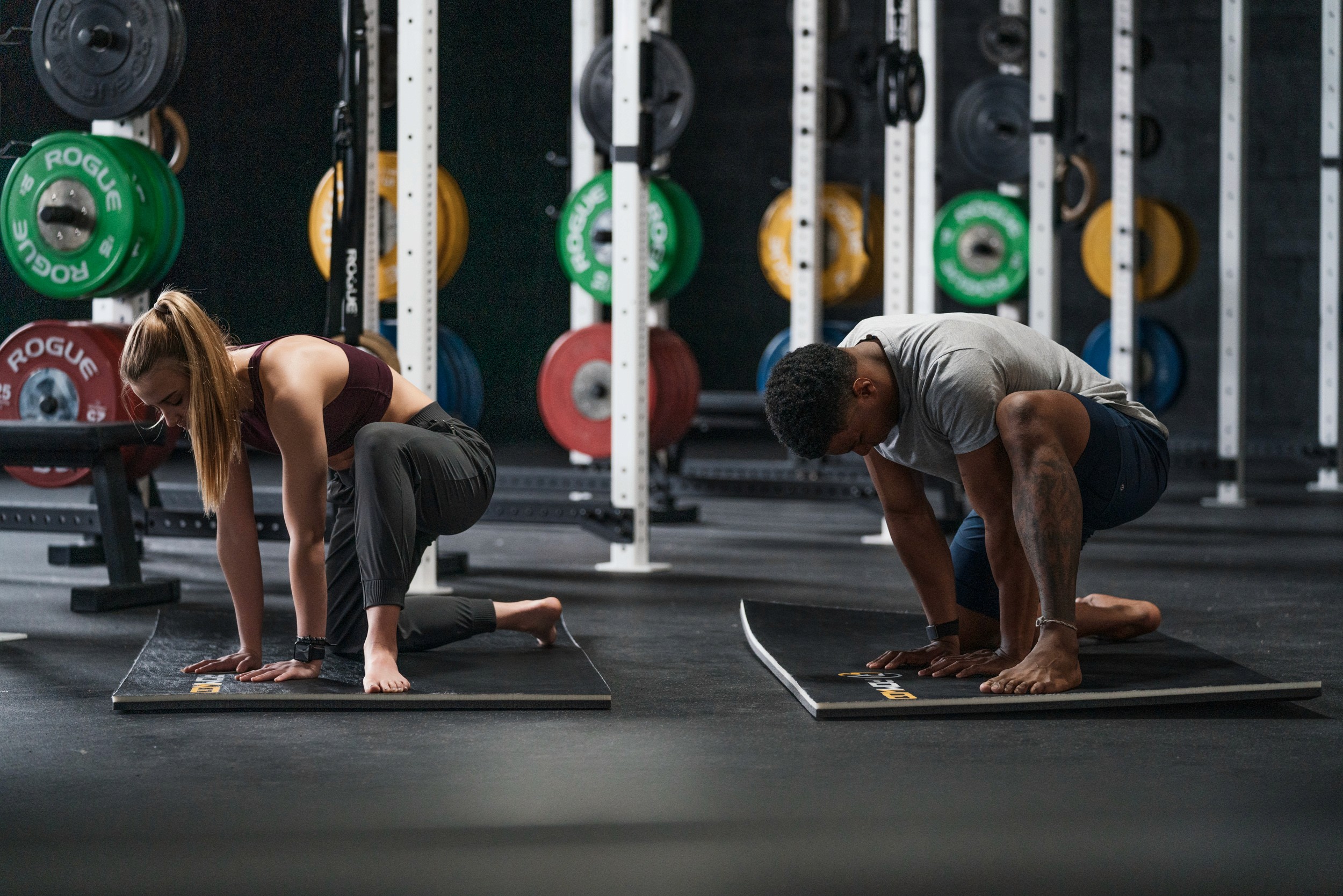 man excising with woman - Stretches For Warehouse Workers