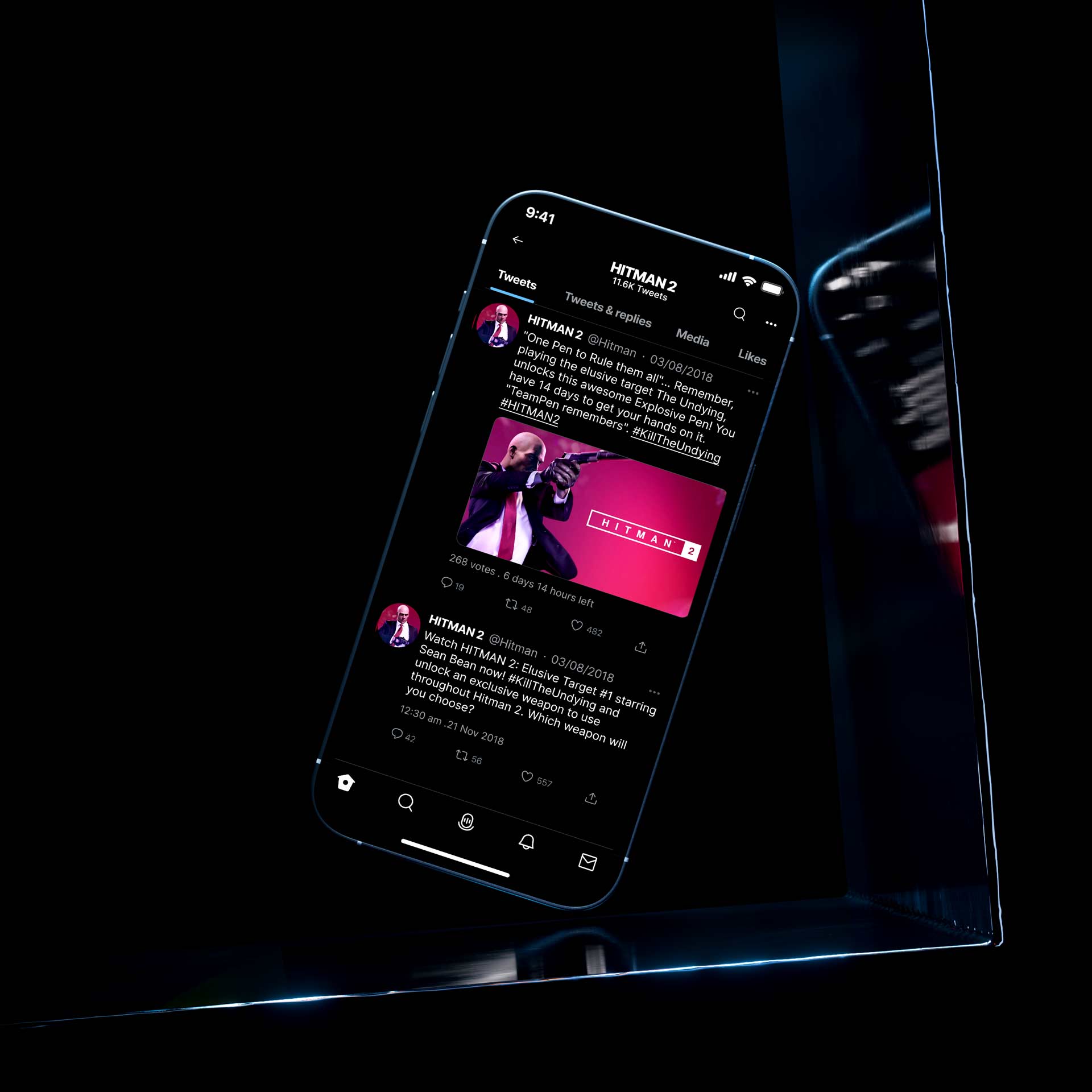 Smartphone displaying HITMAN 2 social media profile with tweets featuring game updates and exclusive event announcements, highlighted with a vibrant red graphic and a game character in a suit