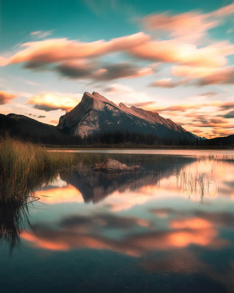 A lake with a mountain in the distance