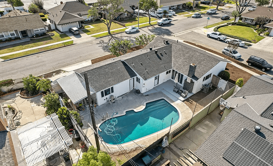 gray 2 seat sofa near brown wooden coffee table
