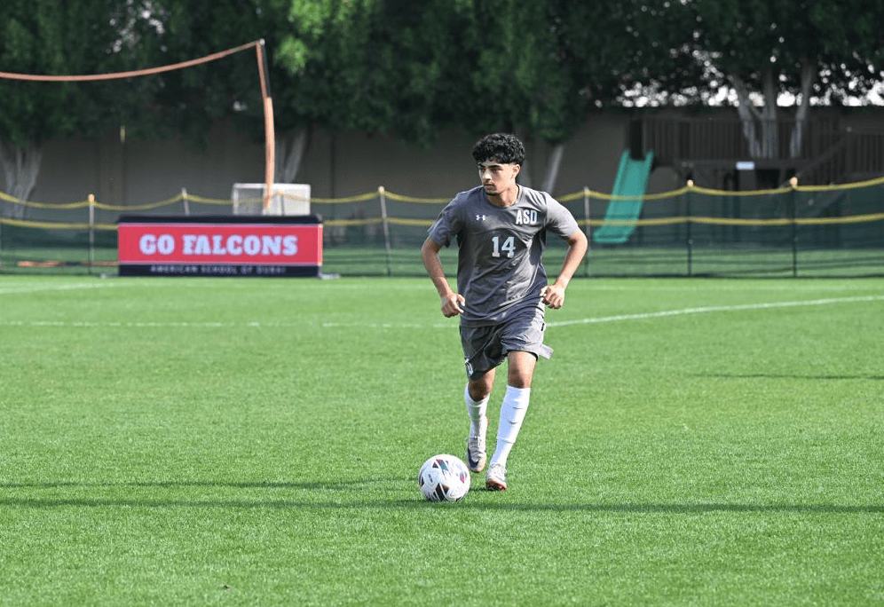 Footballer in action on a pitch