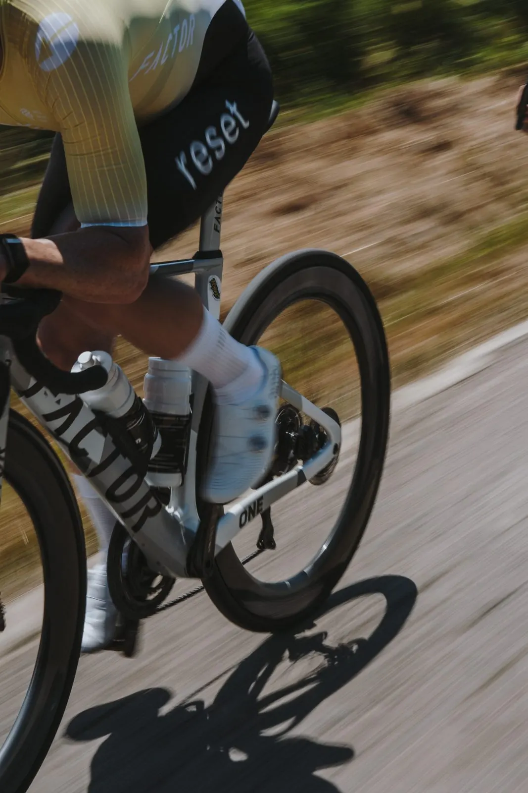 A reset cc rider in team kit on the Factor team bike