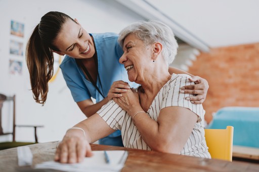 Nurse taking care of old woman