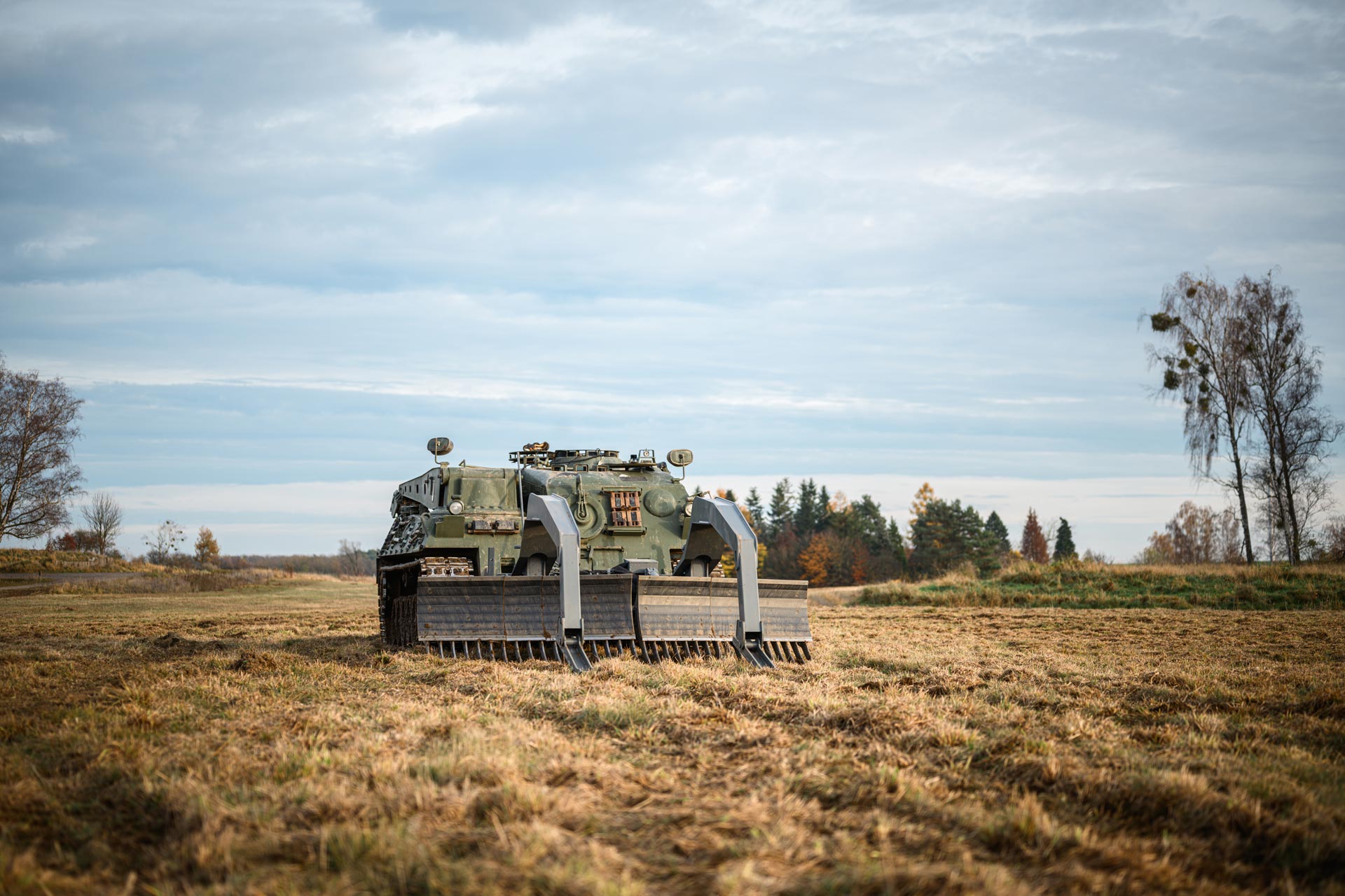 GCS Mine Plough mounted on a tracked armoured vehicle ready for minefield breaching operations in open terrain.