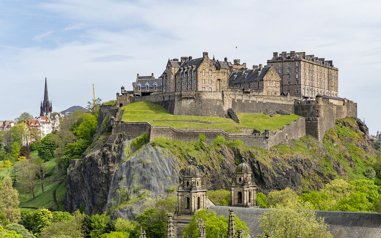 Guided walking tour at Edinburgh Castle, Scotland, showcasing historic architecture and scenic views.