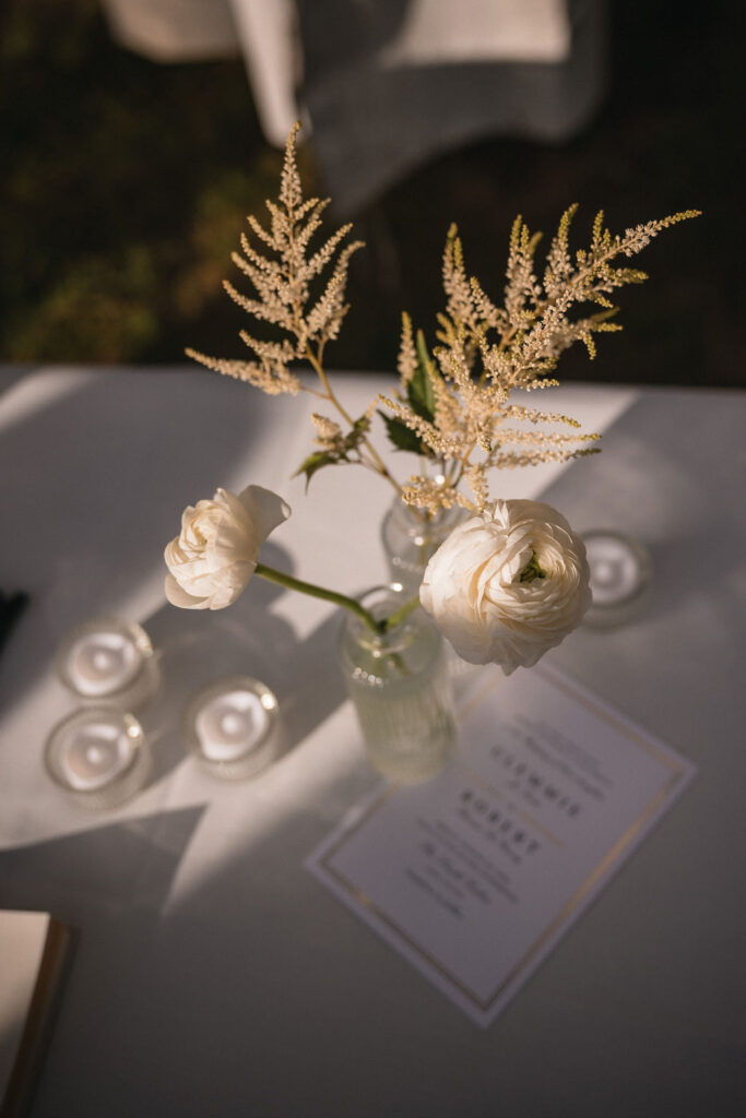 Minimal floral table detail at Smith Cabin Aspen wedding reception with soft natural tones