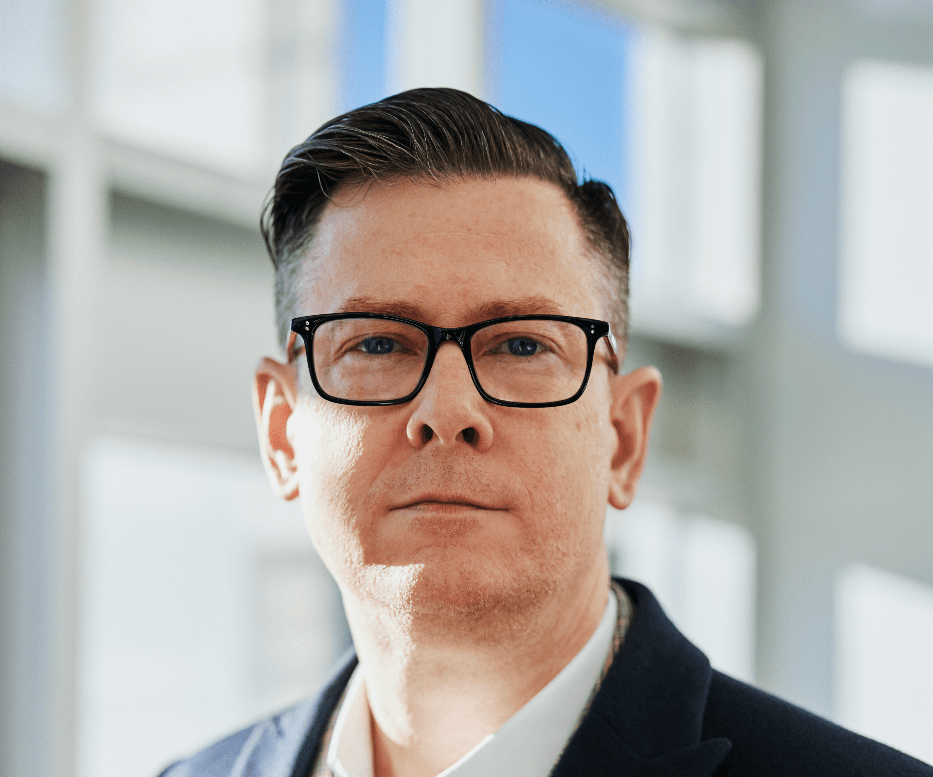 man standing beside wall