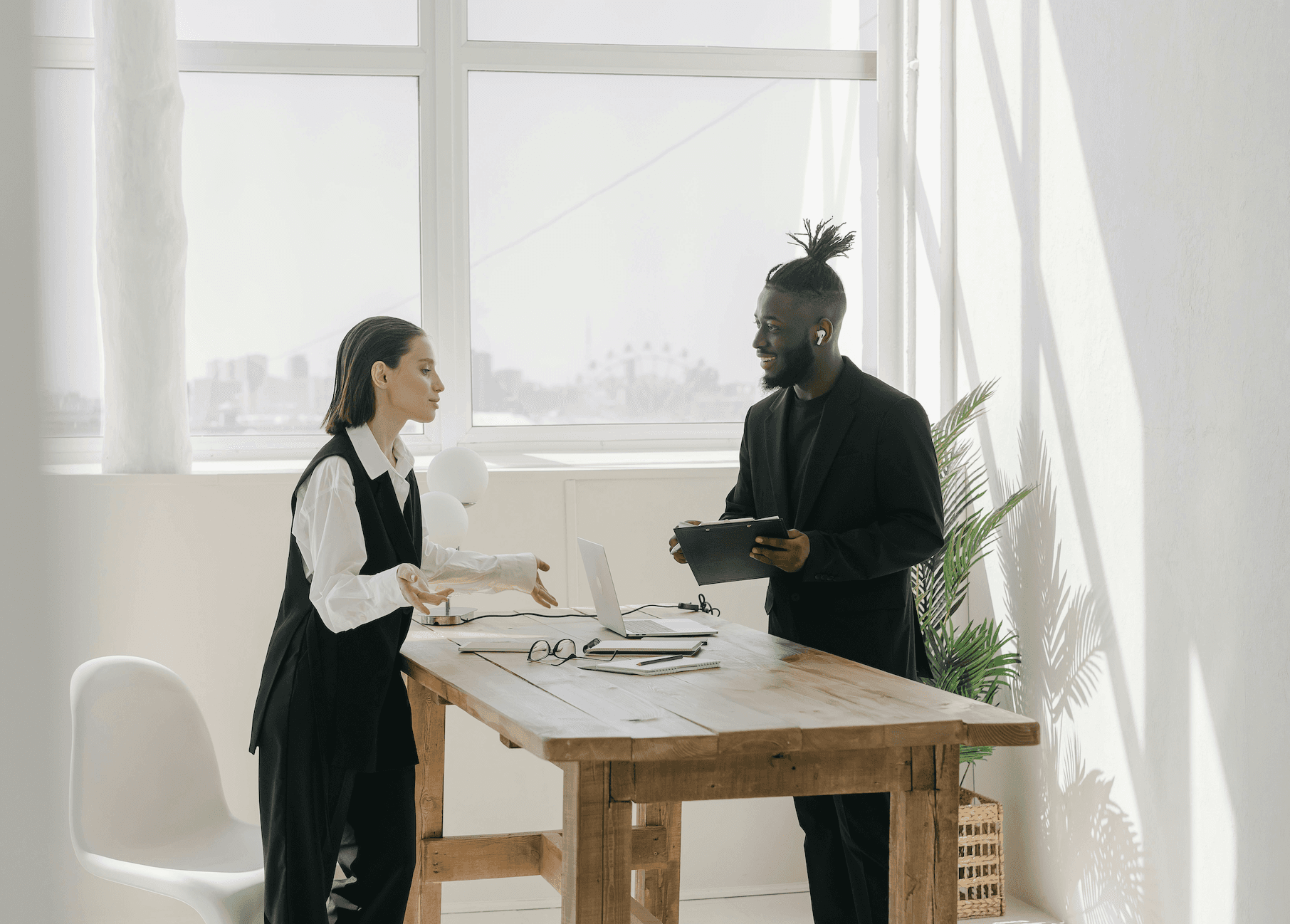a man and a woman with a laptop in a meeting