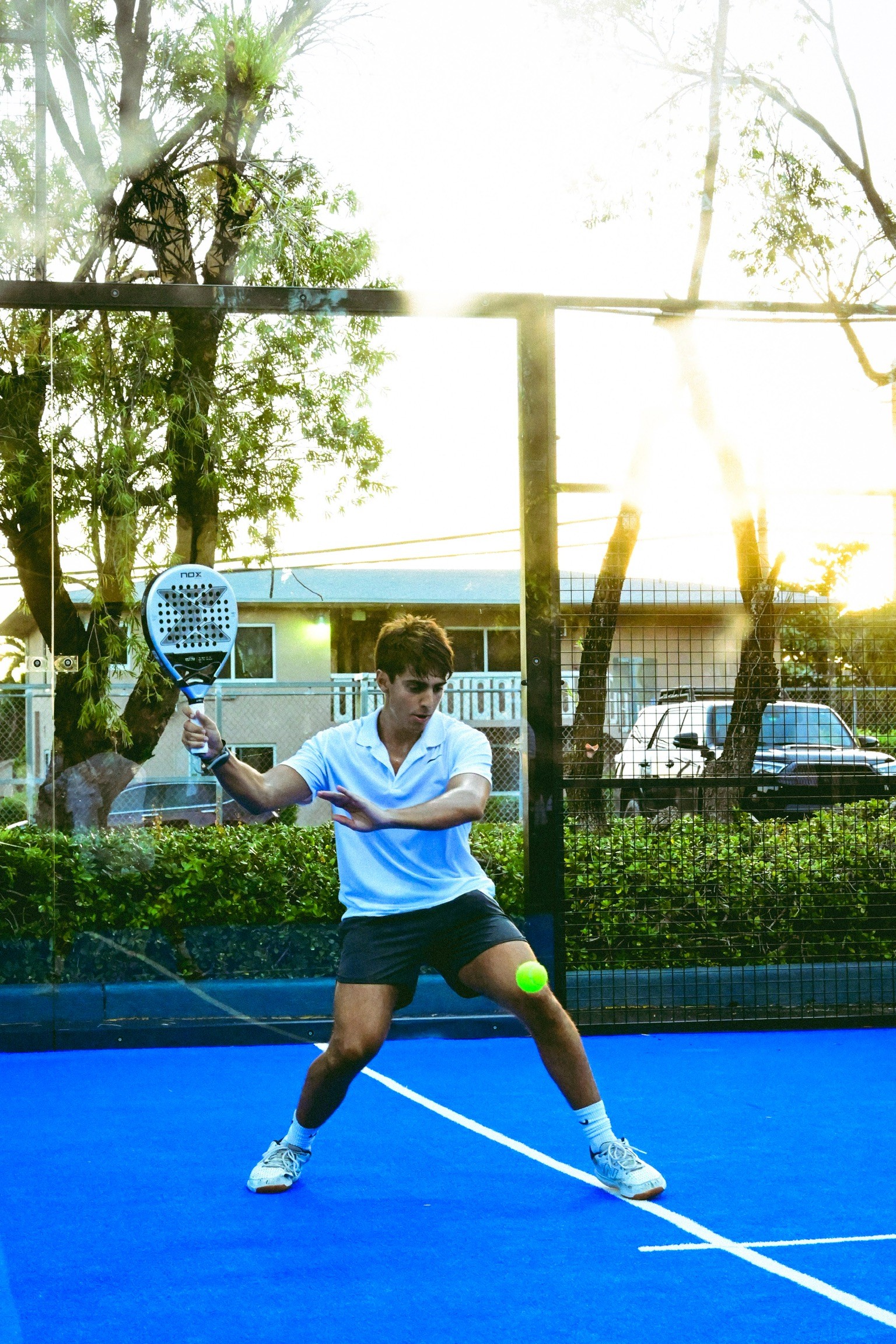 Blur action shot of sneakers on a pickleball court