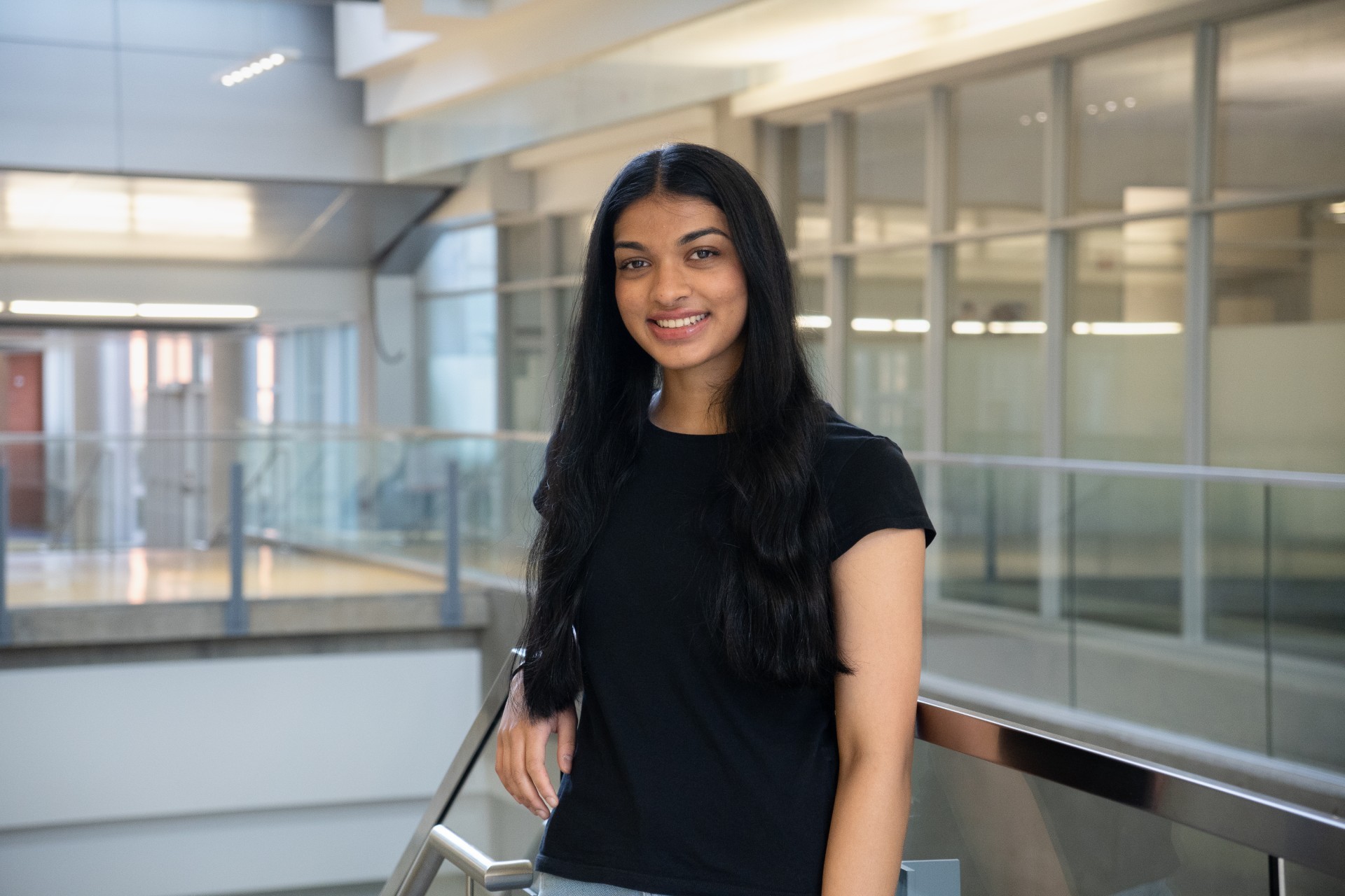 Man in black track suit on a track. Coaching or athlete.