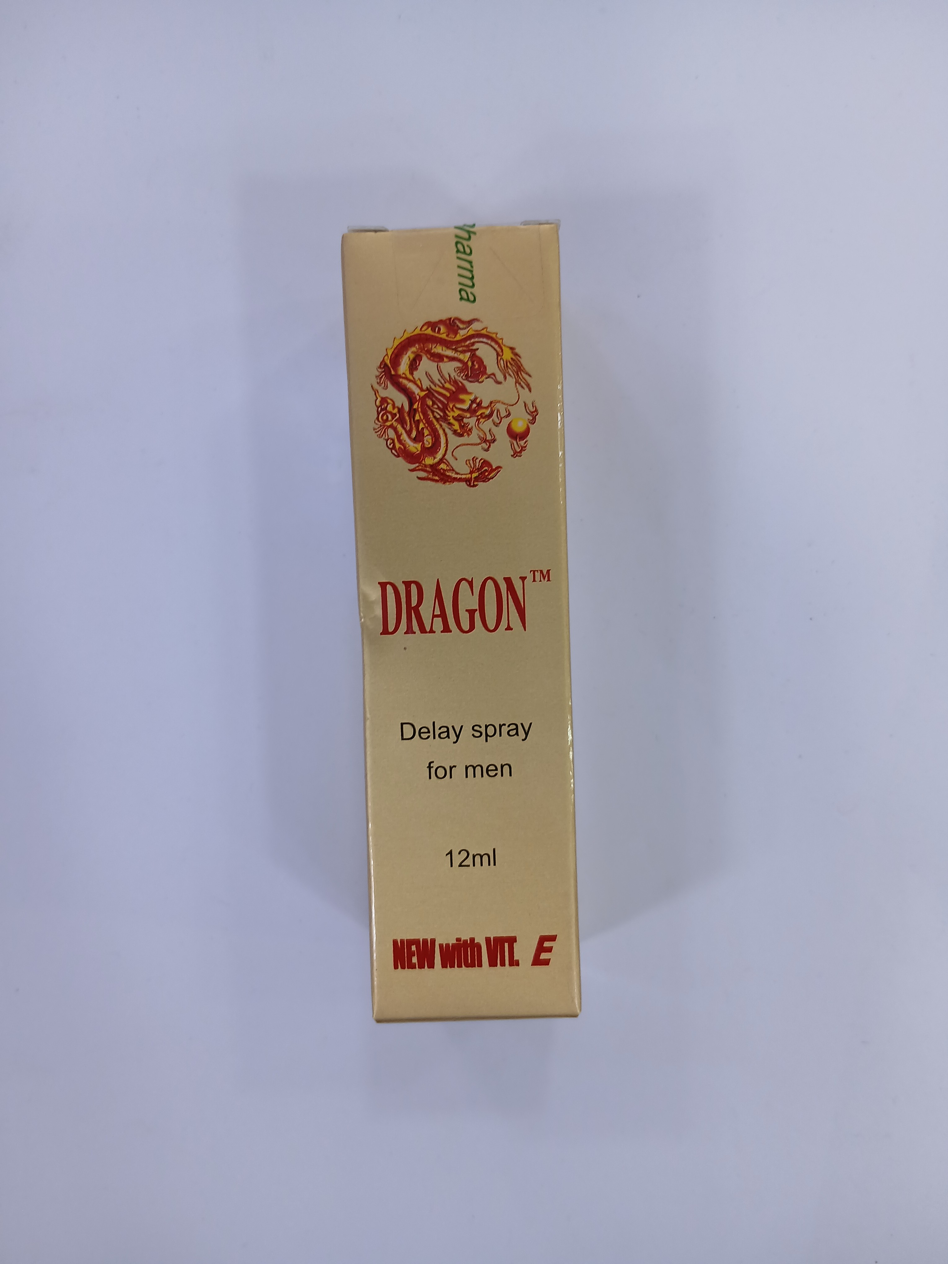 A light brown cardboard box with a red and gold dragon graphic displays text indicating it contains a 12 milliliter spray product for men.