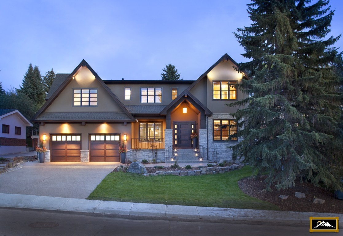 Image of Luxury home exterior with garage and landscaping by KHD Homes, showcasing design and construction expertise.