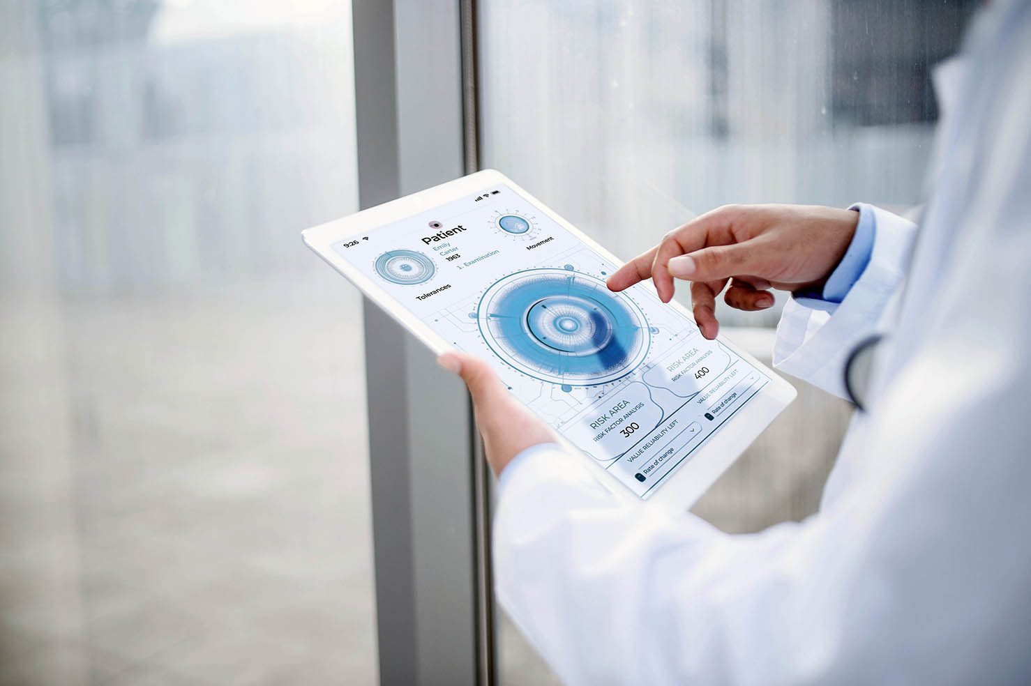 A doctor tapping on a tablet with a medical examination app open.