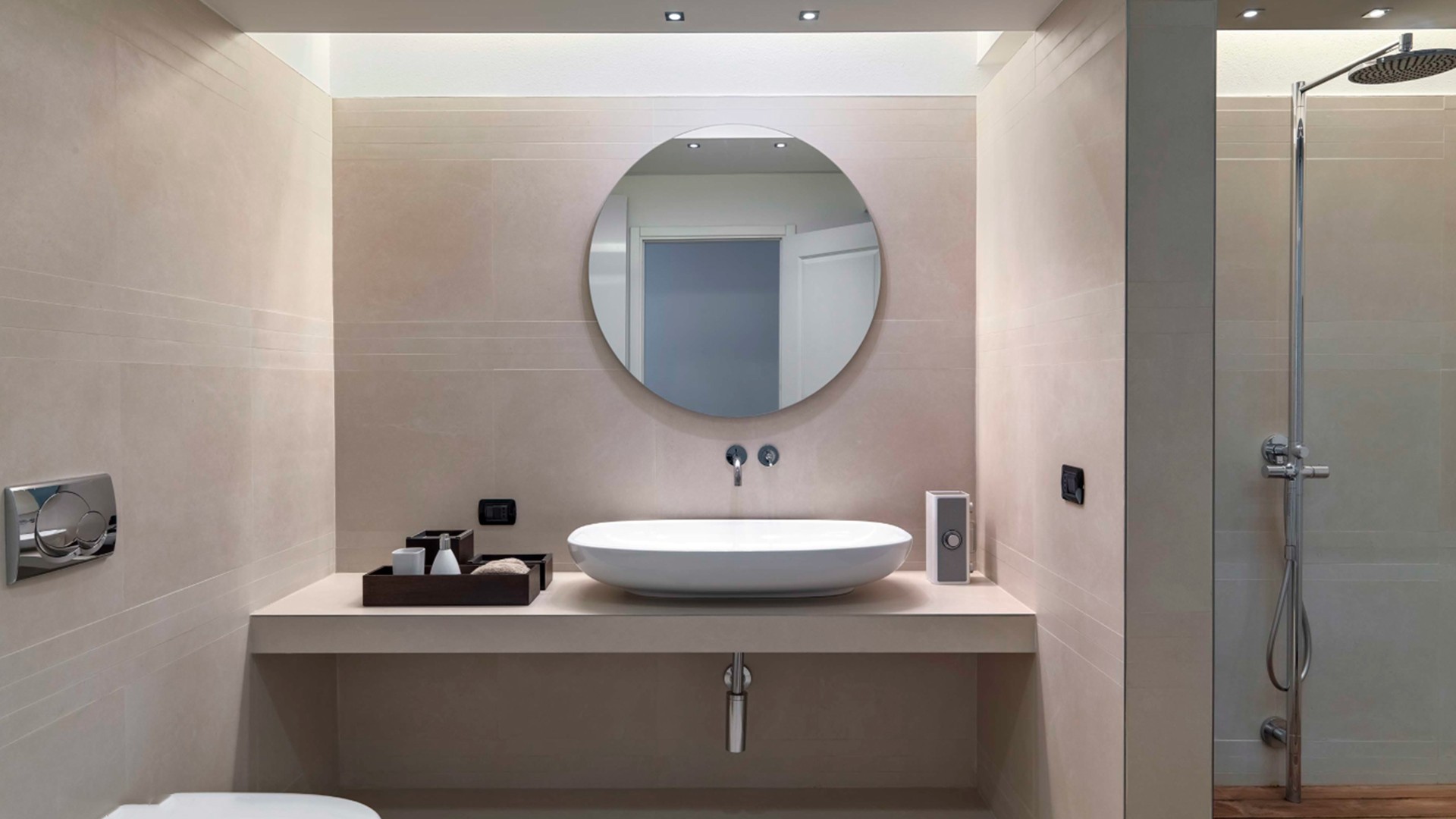 A bathroom featuring a sink, toilet, and shower, designed for functionality and comfort.